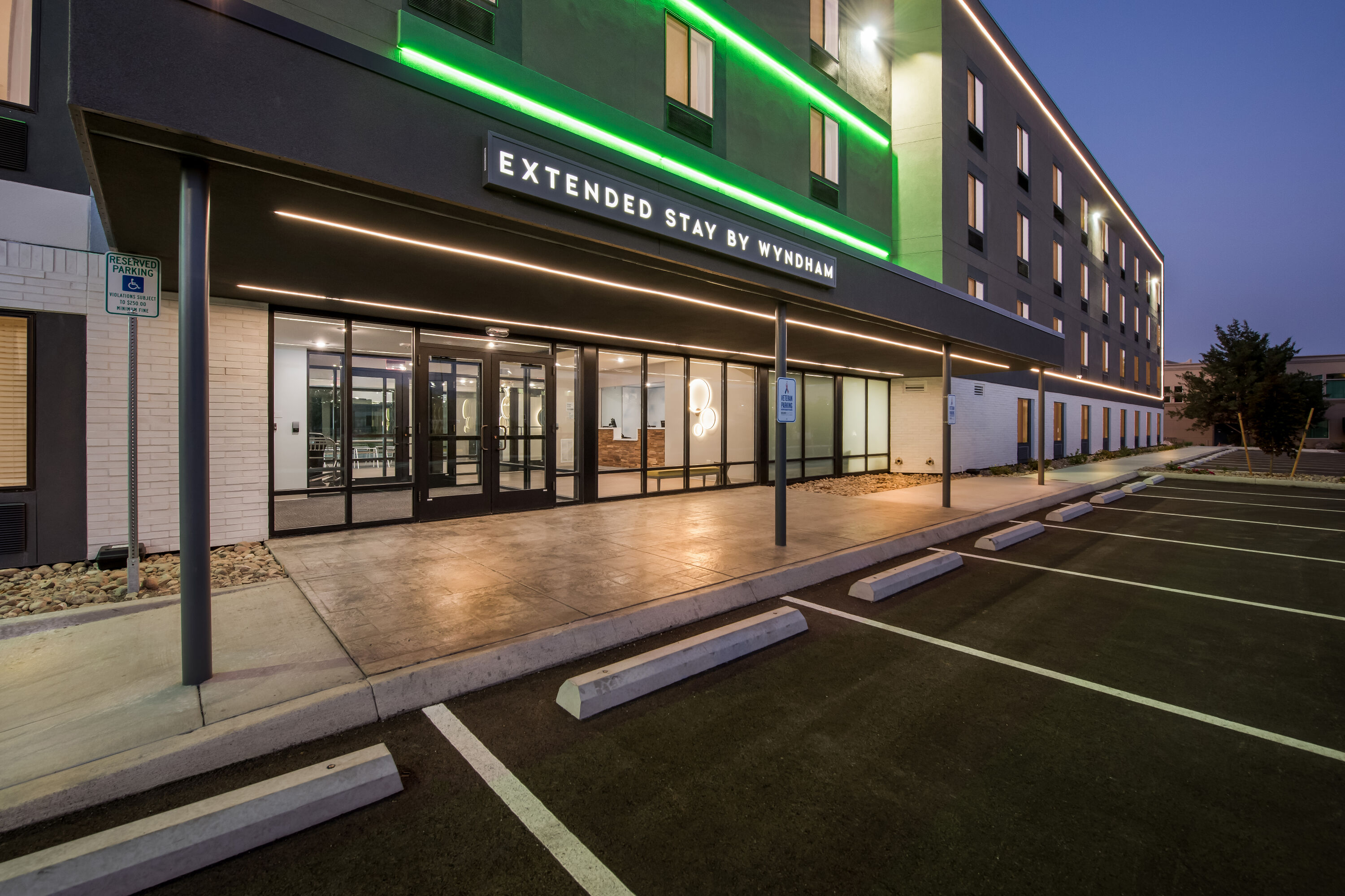 Exterior Night Image of ECHO Suites Extended Stay by Wyndham Reno hotel in Reno, Nevada