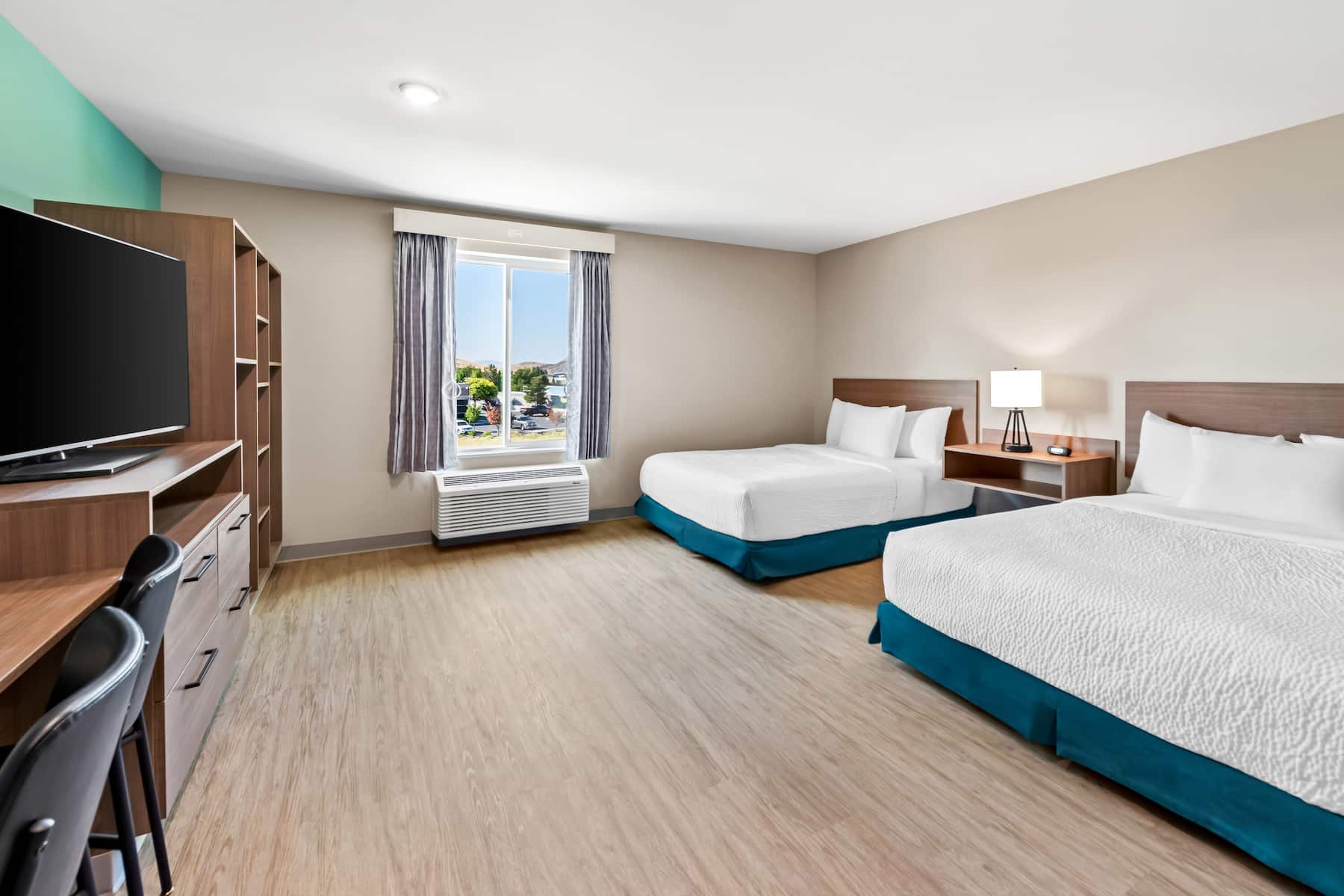 Double bed guest room at the ECHO Suites Extended Stay by Wyndham Reno in Reno, Nevada