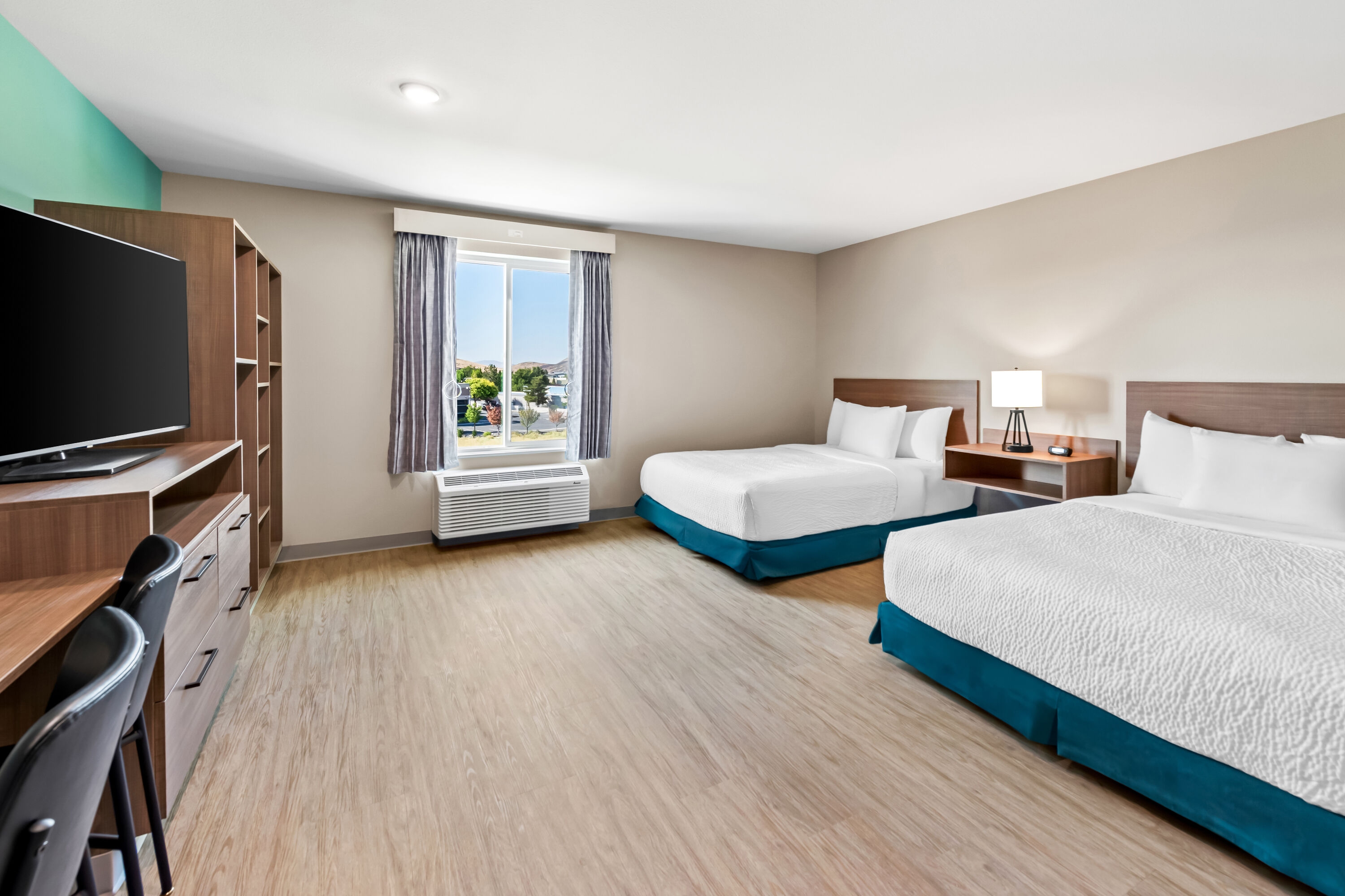 Double bed guest room at the ECHO Suites Extended Stay by Wyndham Reno in Reno, Nevada