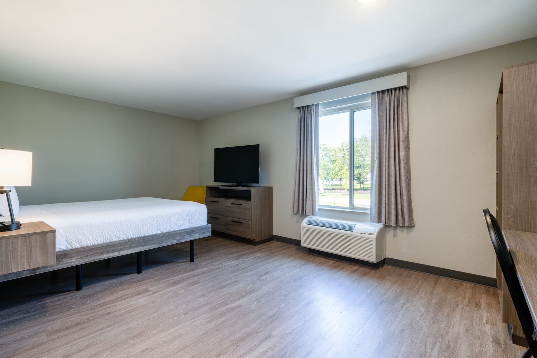 Guest room at the ECHO Suites Extended Stay by Wyndham Spartanburg in Spartanburg, South Carolina