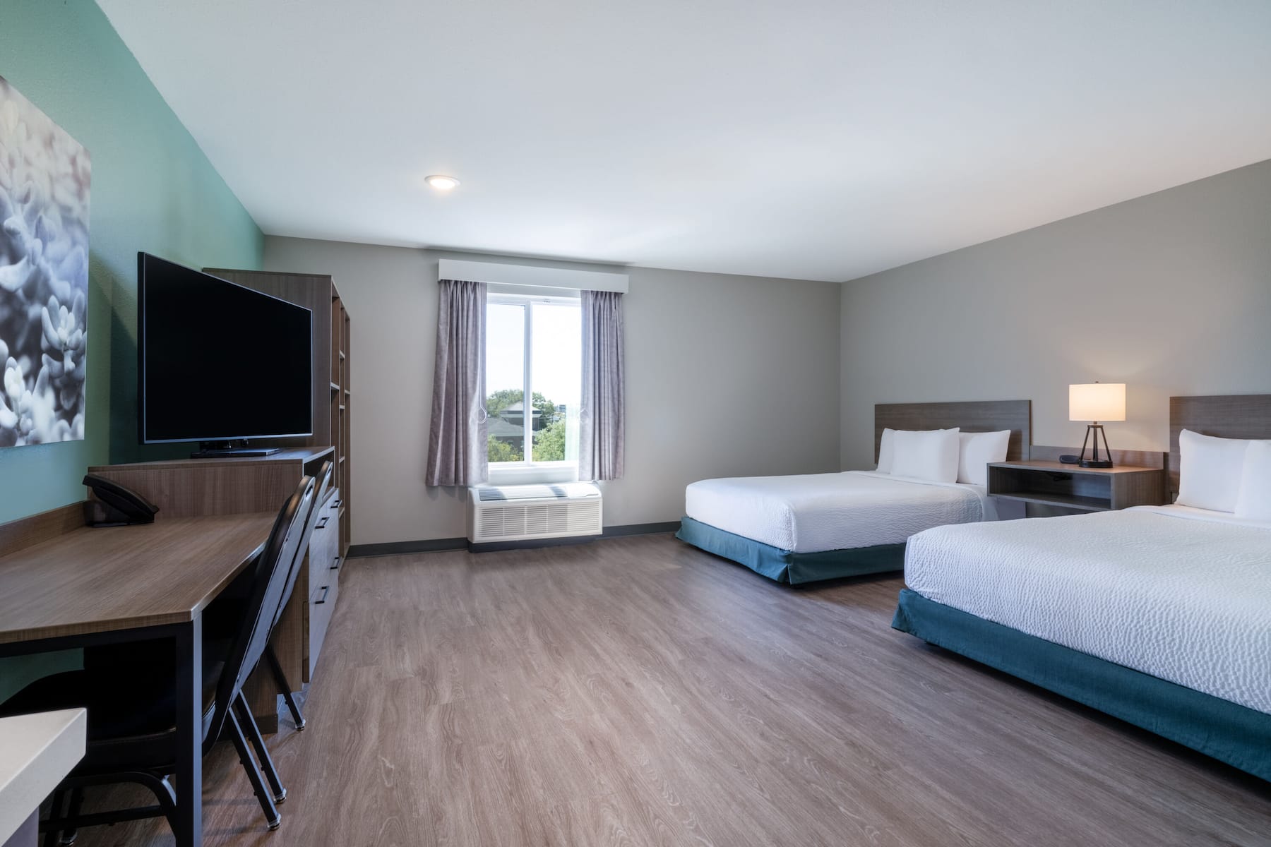 Guest room at the ECHO Suites Extended Stay by Wyndham Spartanburg in Spartanburg, South Carolina