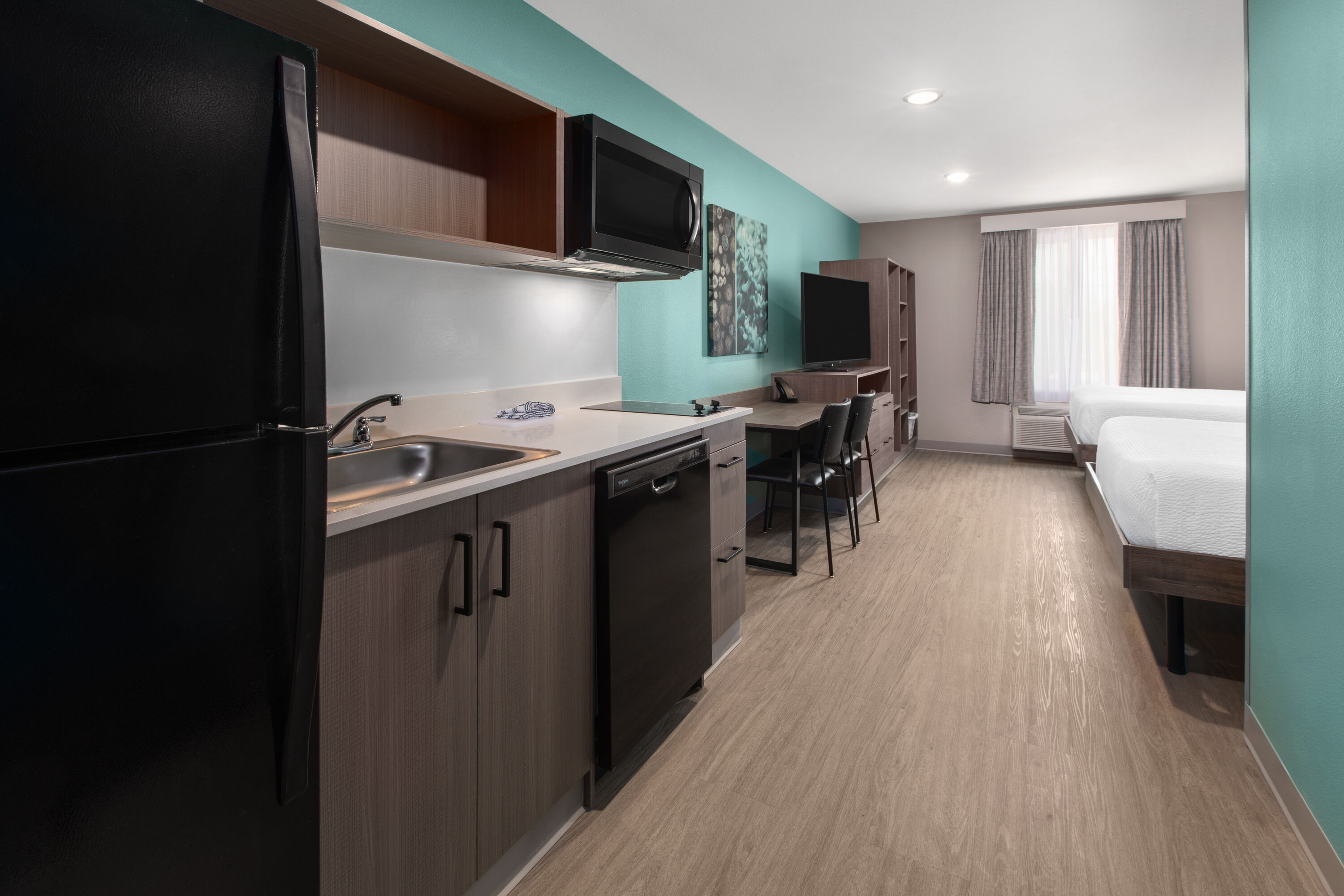 Guest room at the ECHO Suites Extended Stay by Wyndham Fort Worth Alliance in Fort Worth, Texas