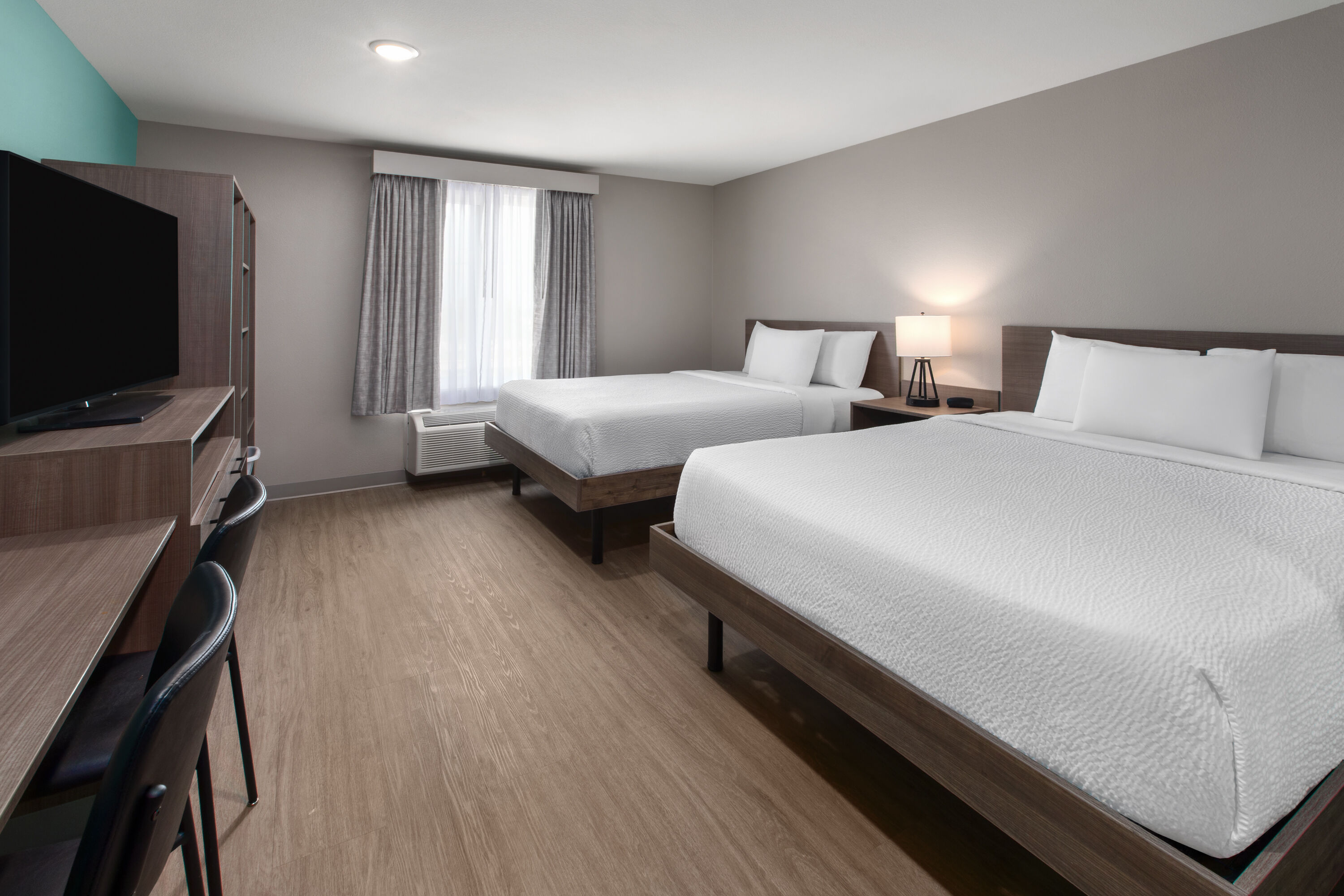 Guest room at the ECHO Suites Extended Stay by Wyndham Fort Worth Alliance in Fort Worth, Texas