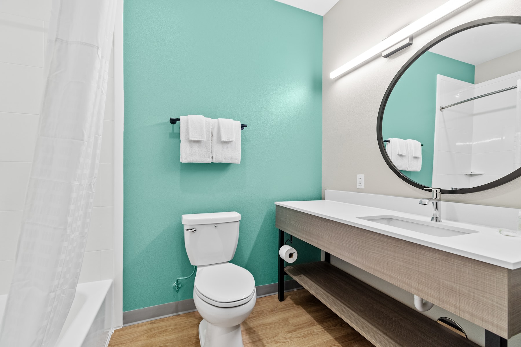 Guest room bath at the ECHO Suites Extended Stay by Wyndham Houston Katy West in Katy, Texas