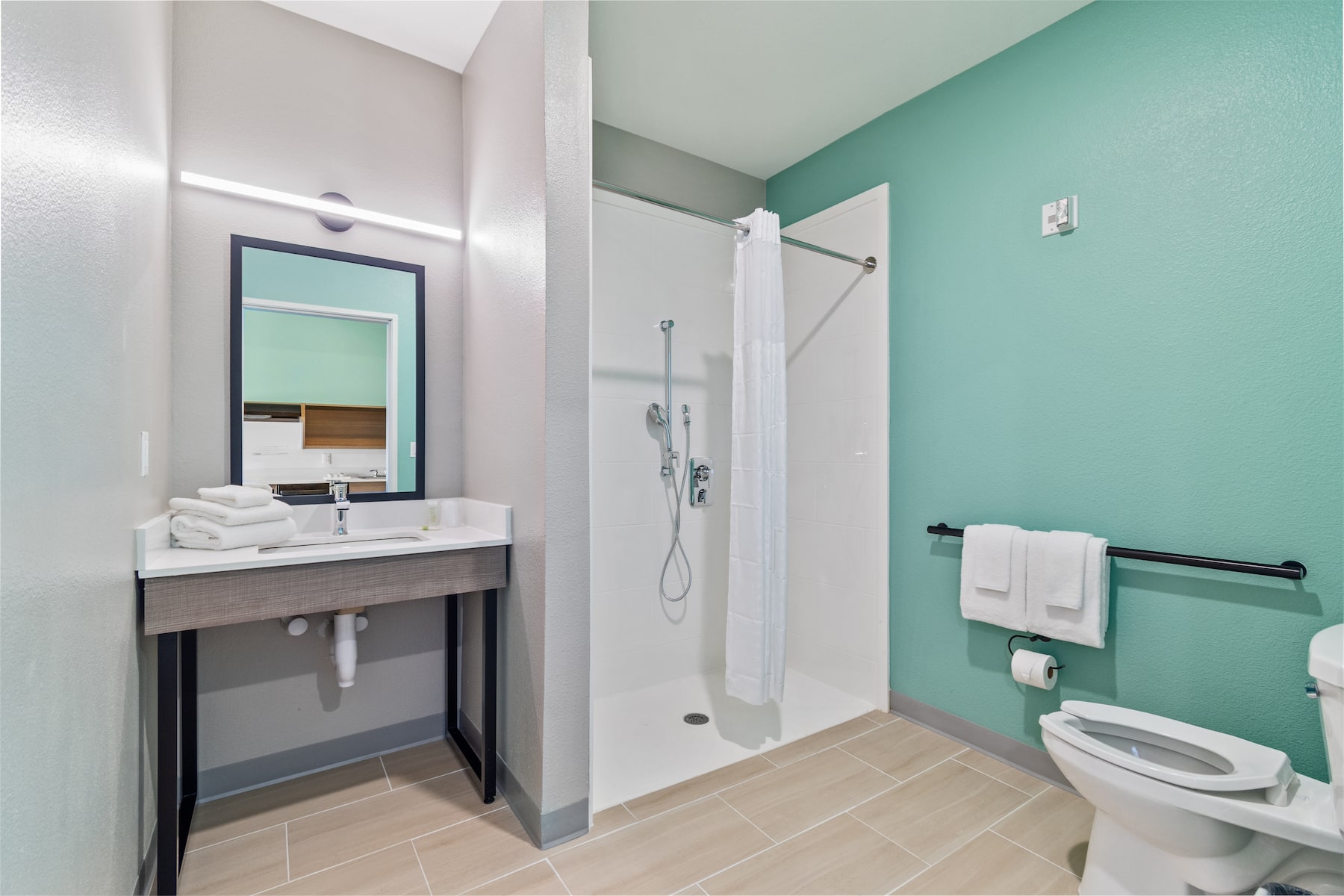 Guest room bath at the ECHO Suites Extended Stay by Wyndham Houston Katy West in Katy, Texas