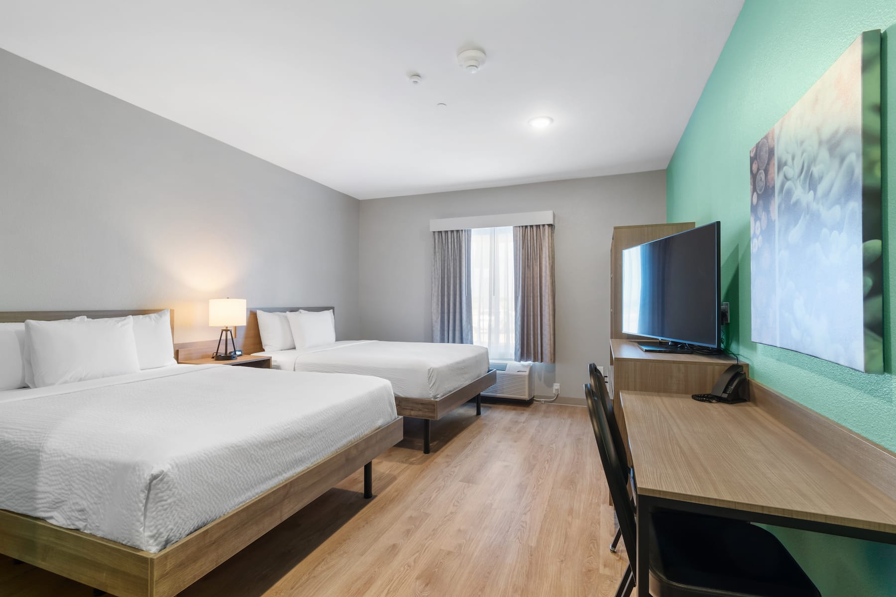 Guest room at the ECHO Suites Extended Stay by Wyndham Houston Katy West in Katy, Texas