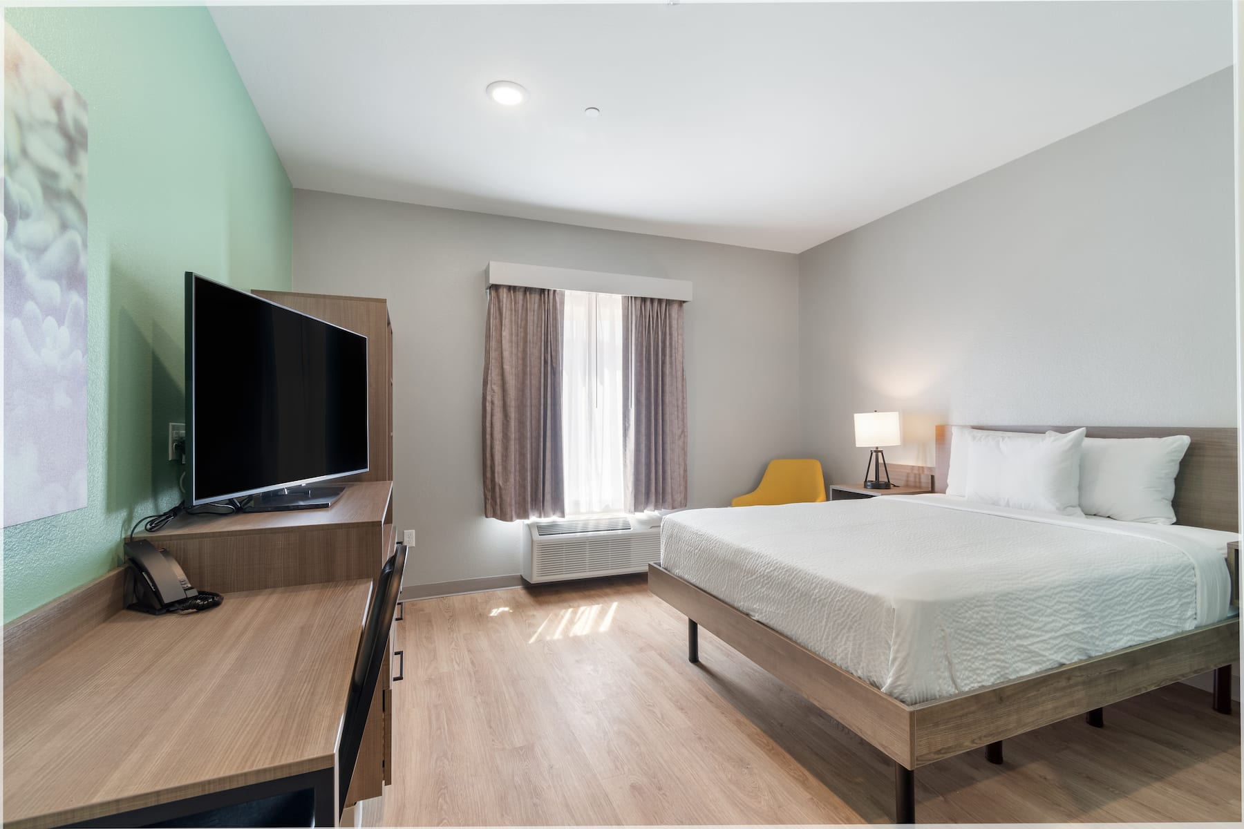 Guest room at the ECHO Suites Extended Stay by Wyndham Houston Katy West in Katy, Texas