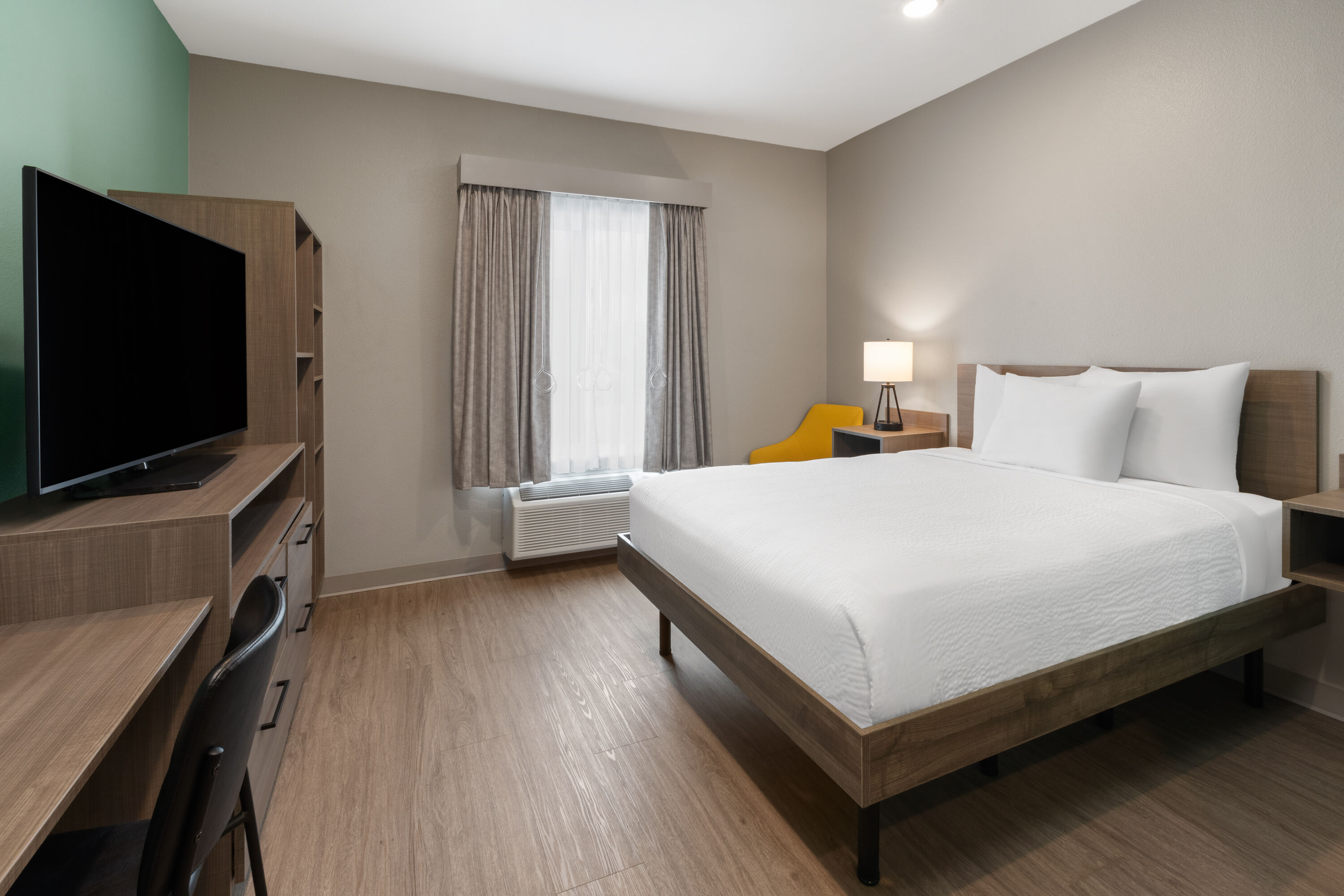Guest room at the ECHO Suites Extended Stay by Wyndham Houston Katy West in Katy, Texas