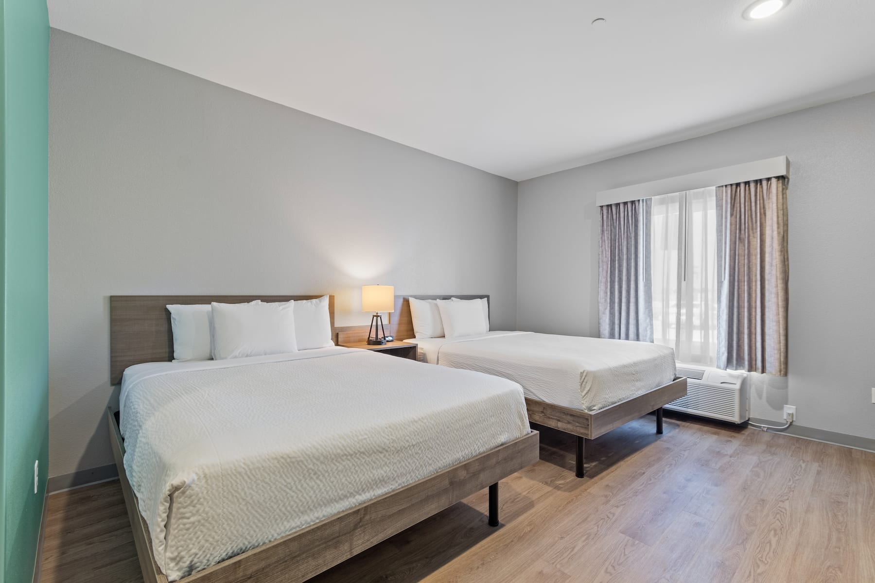 Guest room at the ECHO Suites Extended Stay by Wyndham Houston Katy West in Katy, Texas