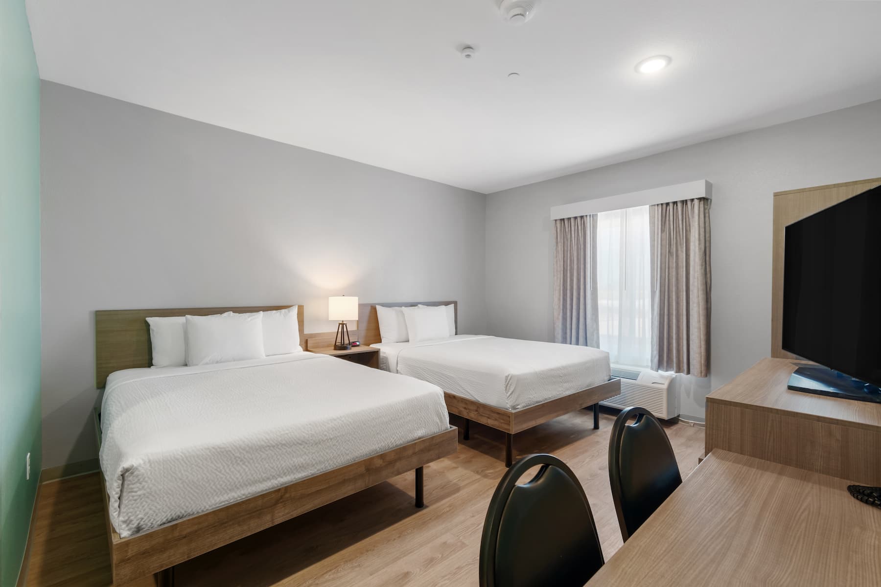 Guest room at the ECHO Suites Extended Stay by Wyndham Houston Katy West in Katy, Texas
