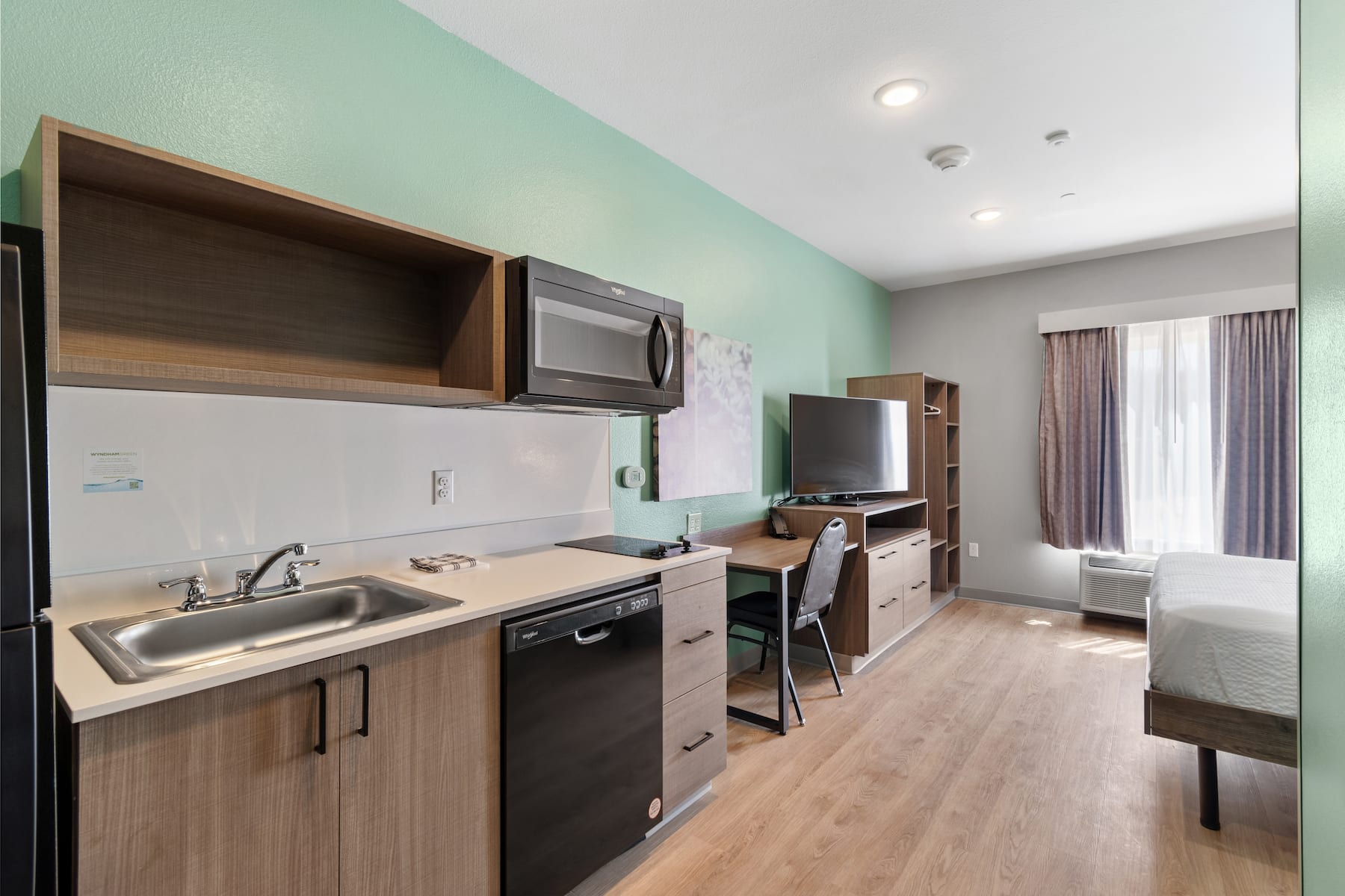 Guest room kitchen at ECHO Suites Extended Stay by Wyndham Houston Katy West in Katy, Texas