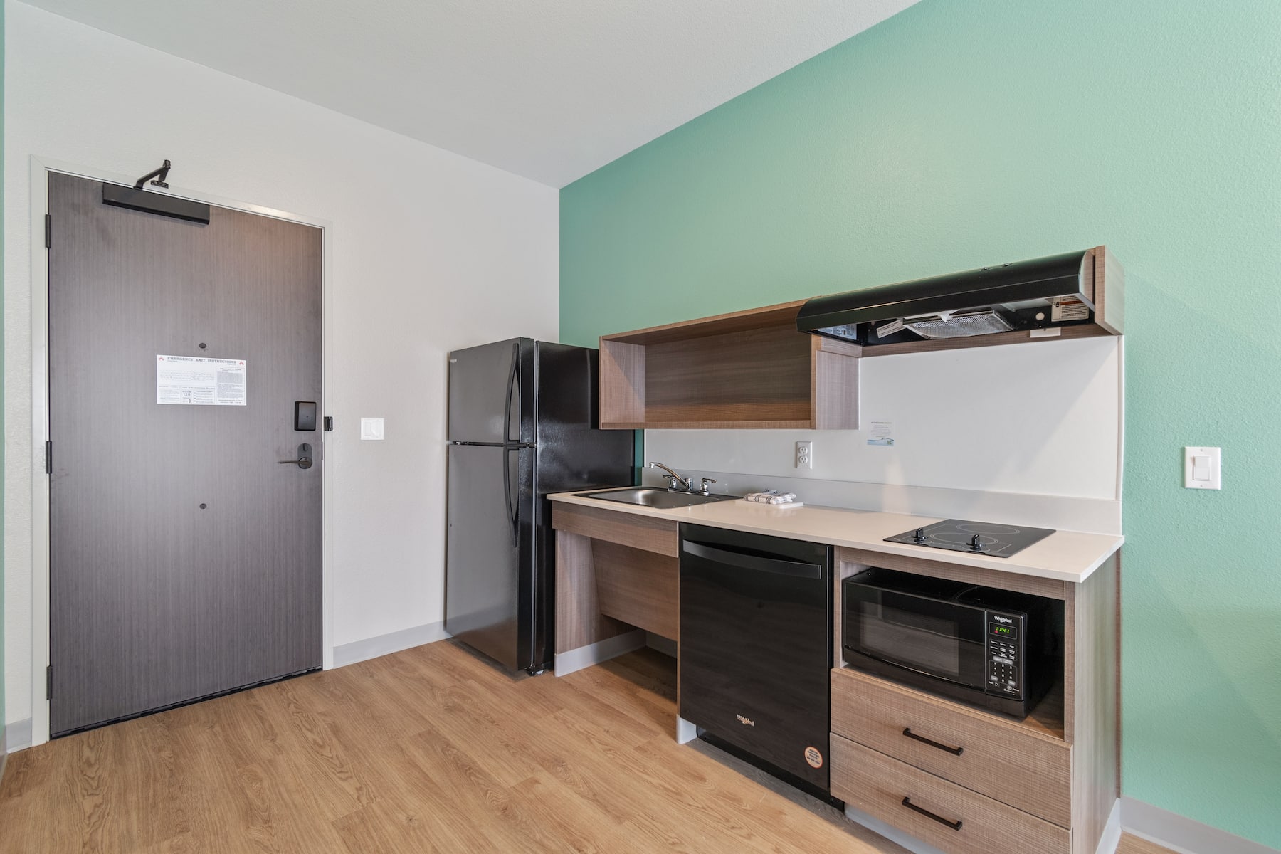 Guest room kitchen at ECHO Suites Extended Stay by Wyndham Houston Katy West in Katy, Texas
