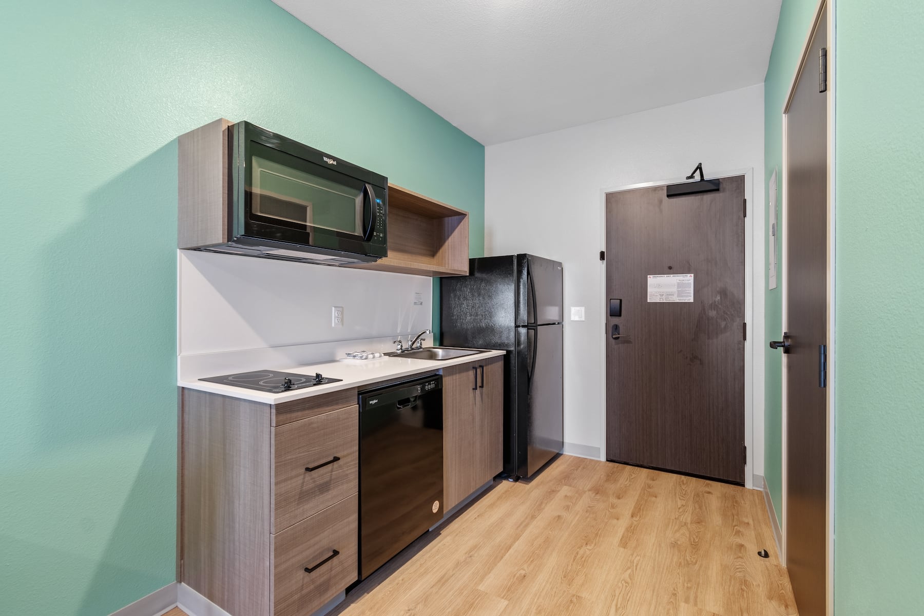 Guest room kitchen at ECHO Suites Extended Stay by Wyndham Houston Katy West in Katy, Texas