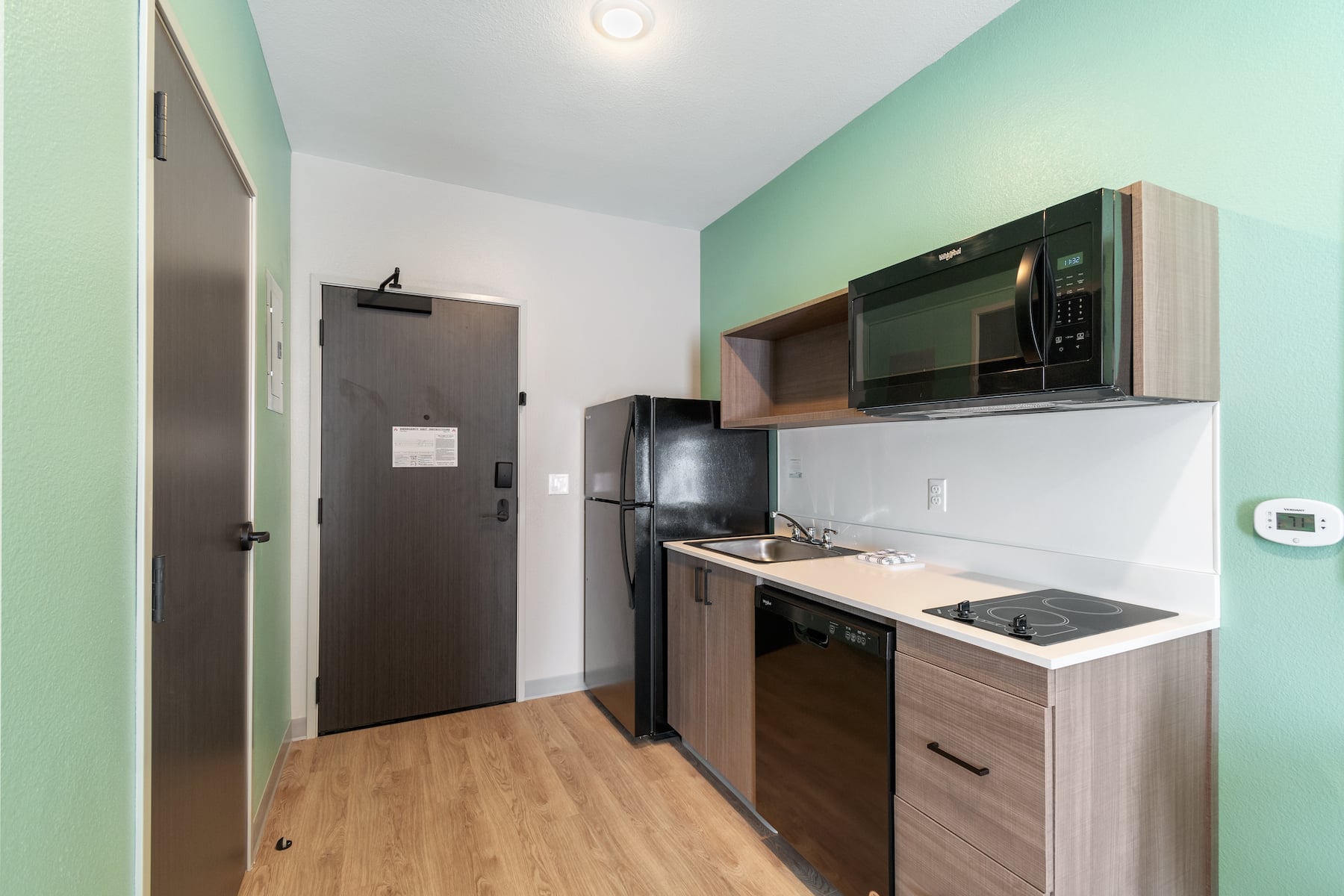 Guest room kitchen at ECHO Suites Extended Stay by Wyndham Houston Katy West in Katy, Texas