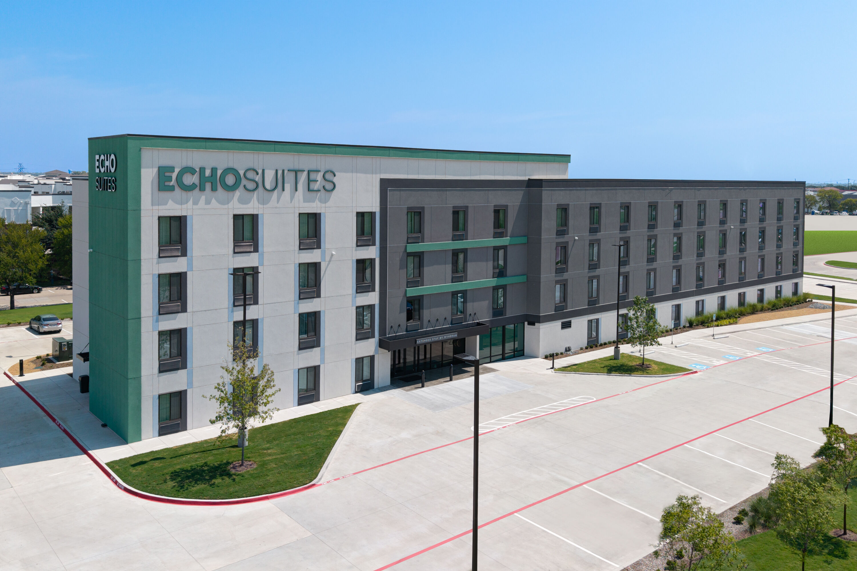 Exterior Day Image of ECHO Suites Extended Stay by Wyndham Dallas Plano/Richardson hotel in Plano, Texas
