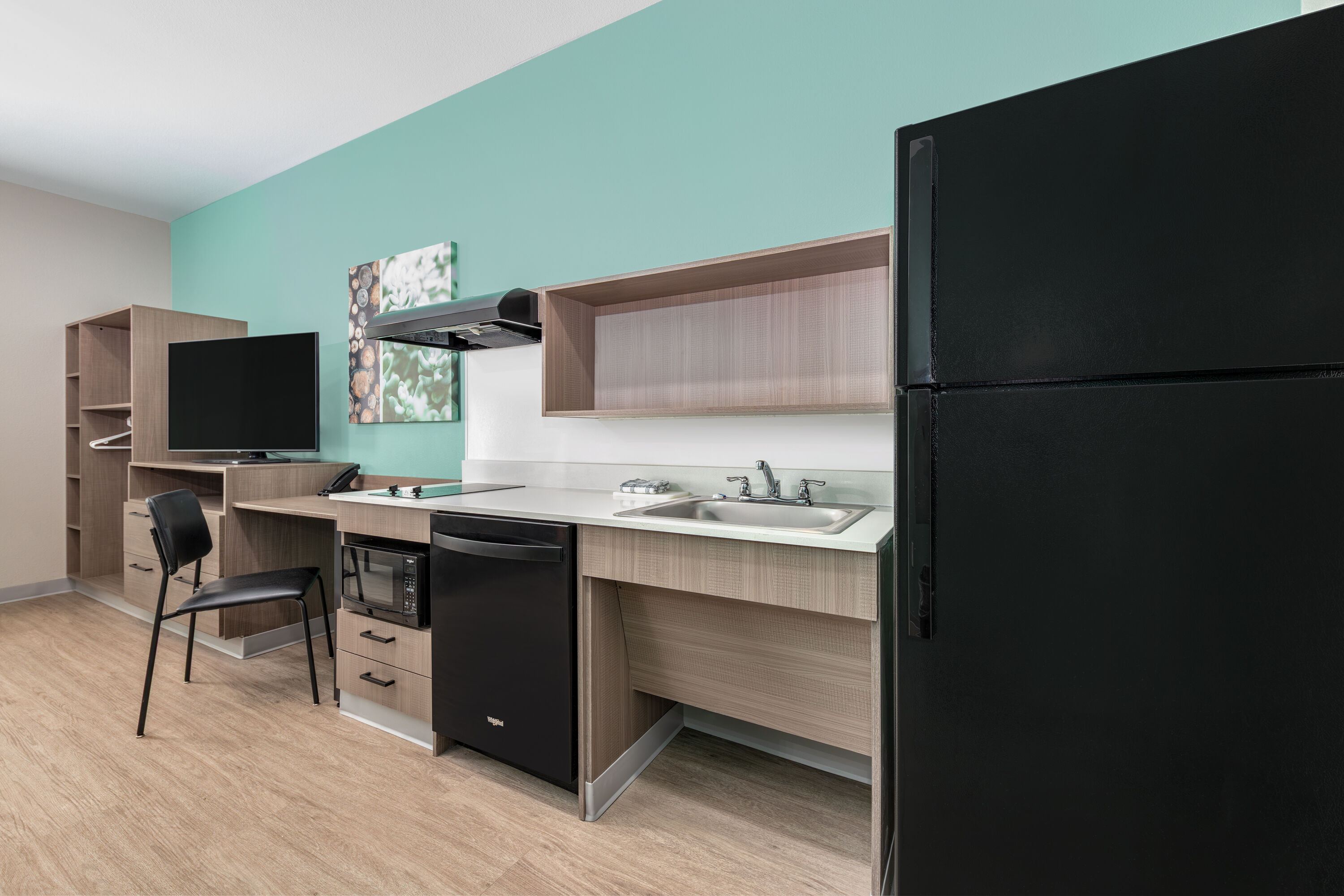 Guest room at the ECHO Suites Extended Stay by Wyndham Dallas Plano/Richardson in Plano, Texas