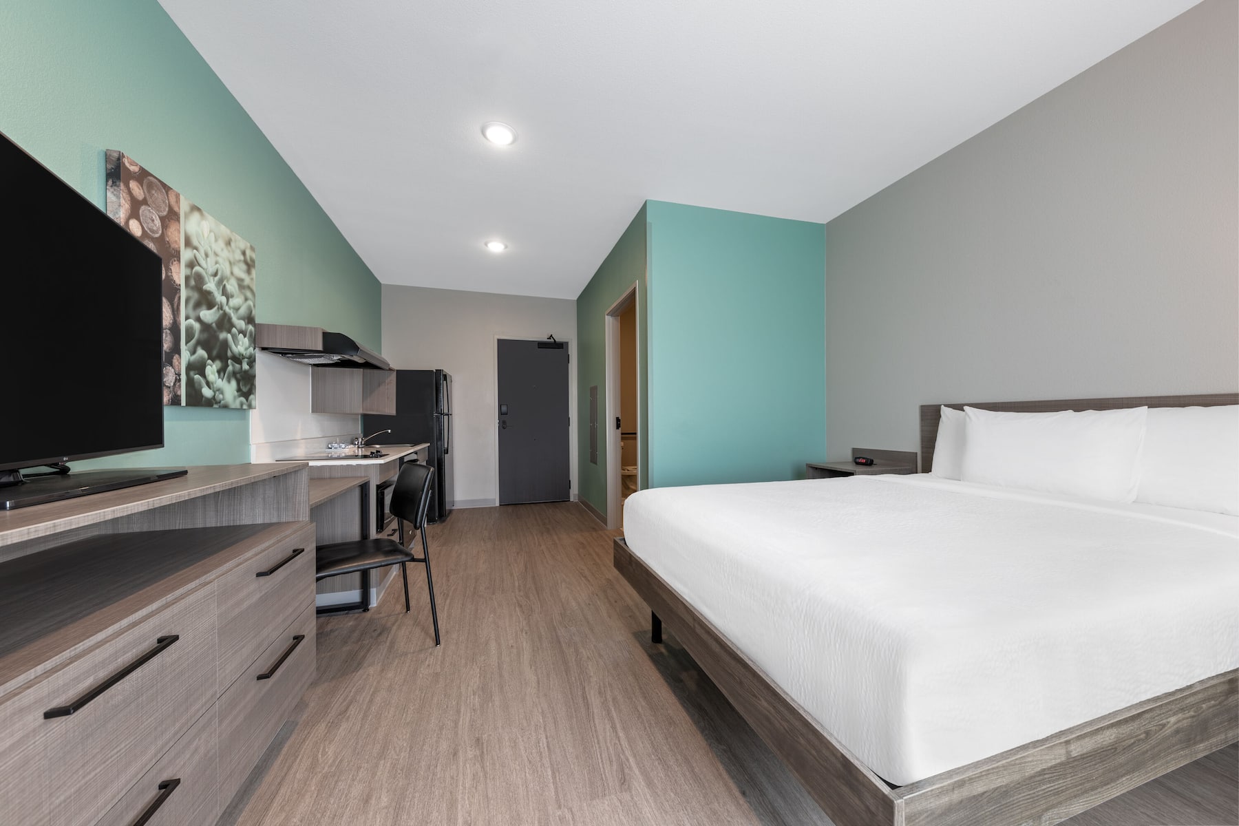 Guest room at the ECHO Suites Extended Stay by Wyndham Dallas Plano/Richardson in Plano, Texas