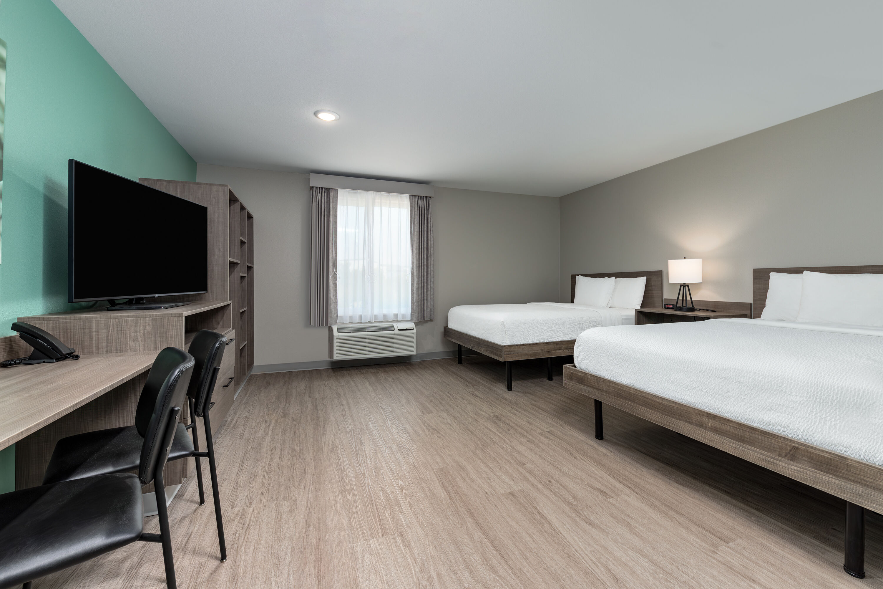 Guest room at the ECHO Suites Extended Stay by Wyndham Dallas Plano/Richardson in Plano, Texas