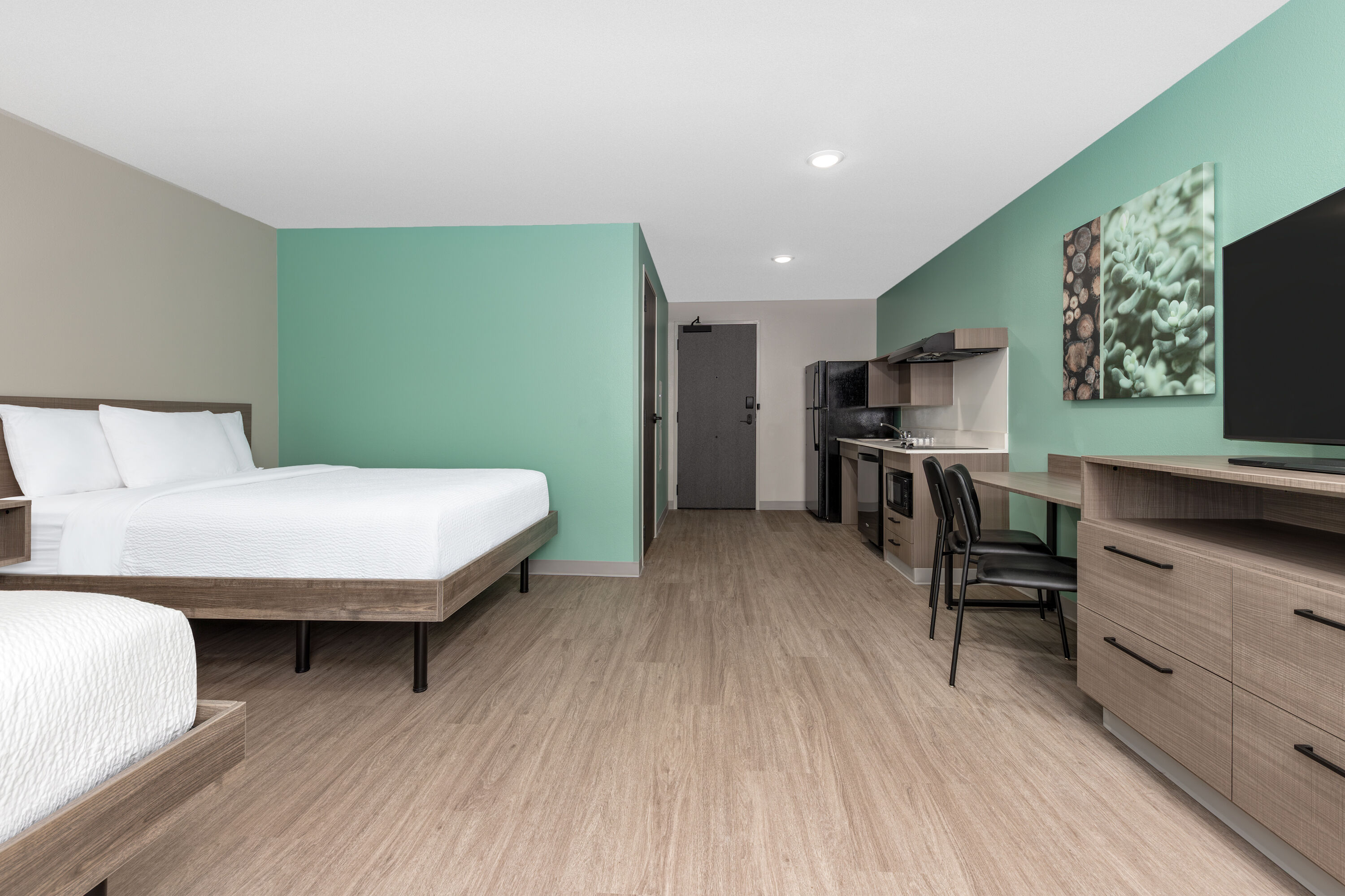 Guest room at the ECHO Suites Extended Stay by Wyndham Dallas Plano/Richardson in Plano, Texas