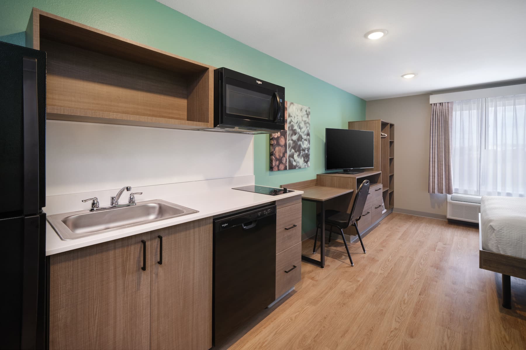 Guest room at the ECHO Suites Extended Stay by Wyndham Dallas Plano/Frisco in Plano, Texas