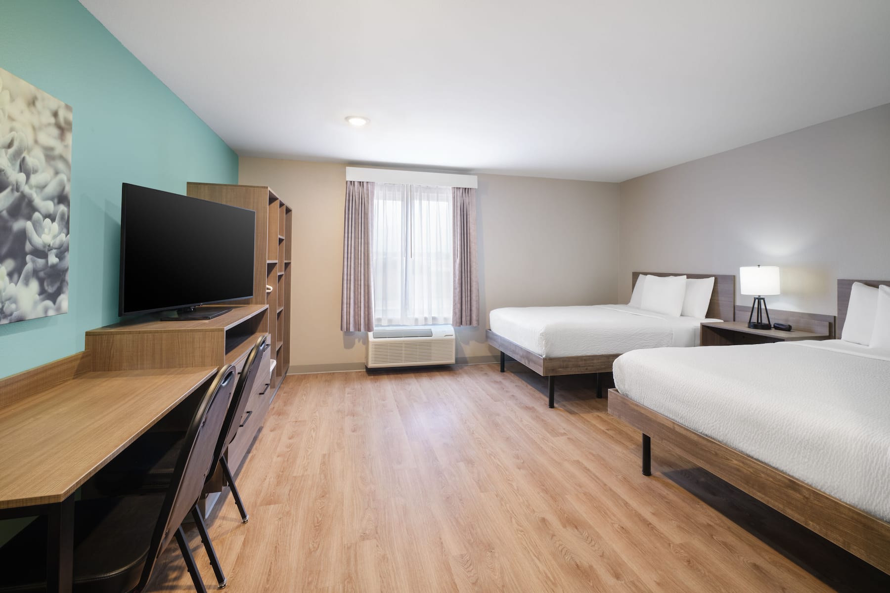 Guest room at the ECHO Suites Extended Stay by Wyndham Dallas Plano/Frisco in Plano, Texas