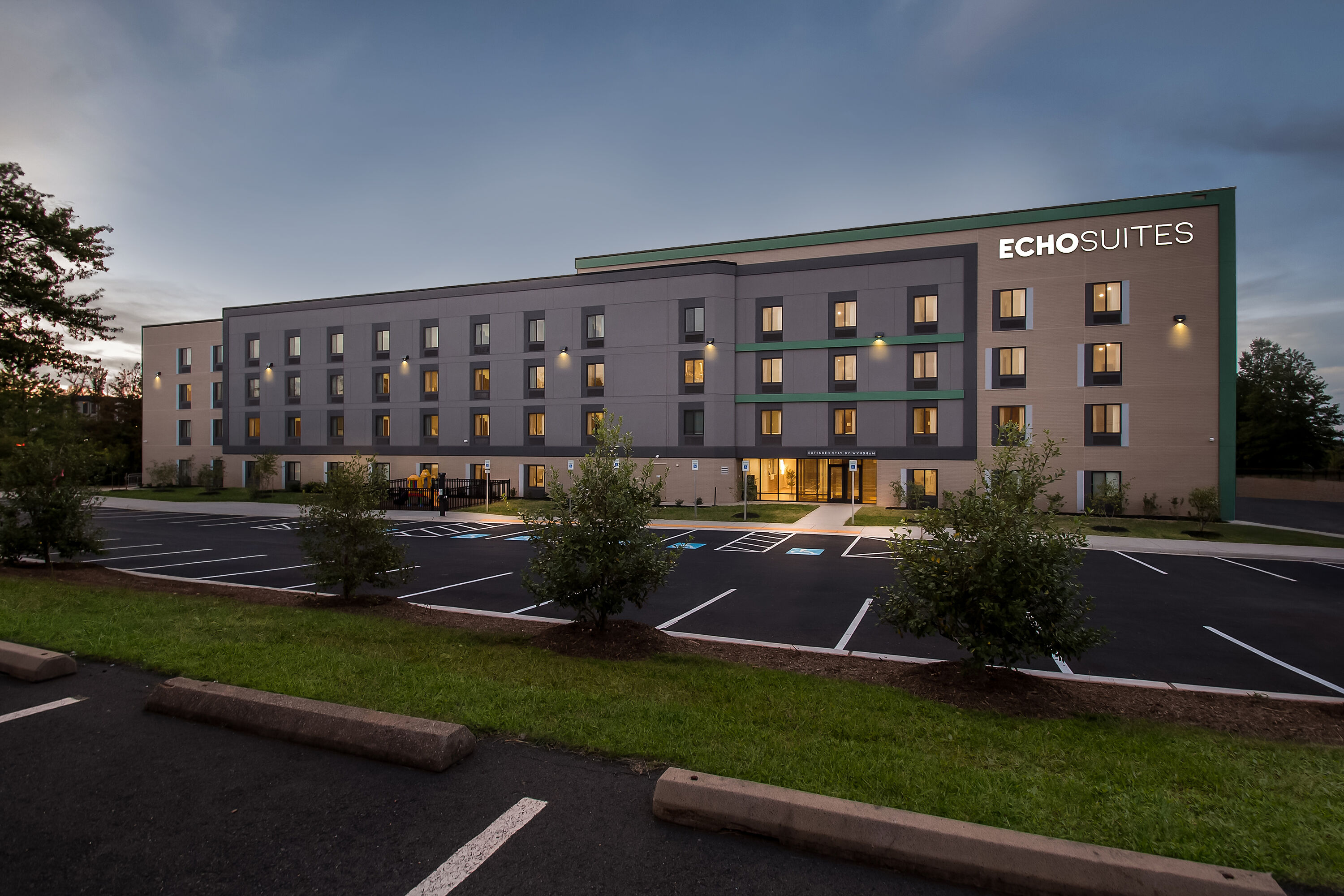 Exterior Night Image of ECHO Suites Extended Stay by Wyndham Sterling hotel in Sterling, Virginia