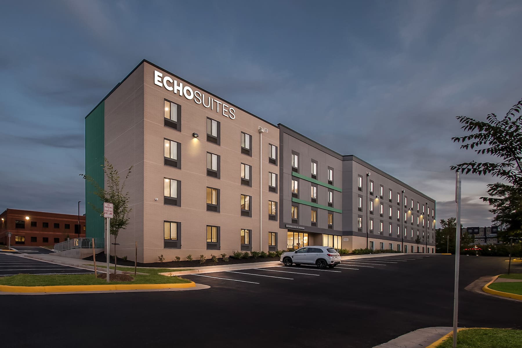 Exterior Night Image of ECHO Suites Extended Stay by Wyndham Sterling hotel in Sterling, Virginia