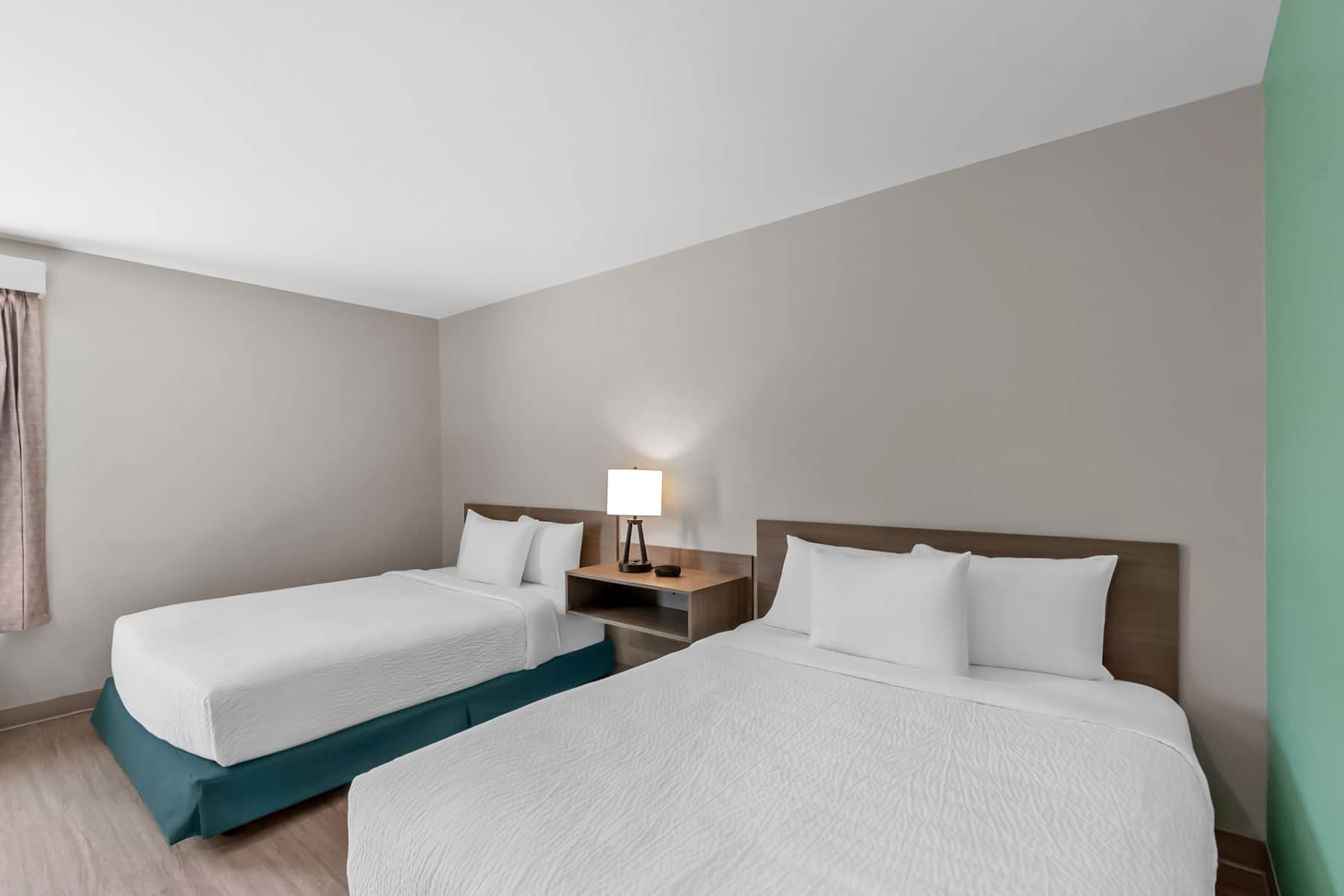 Double bed guest room at the ECHO Suites Extended Stay by Wyndham Sterling in Sterling, Virginia