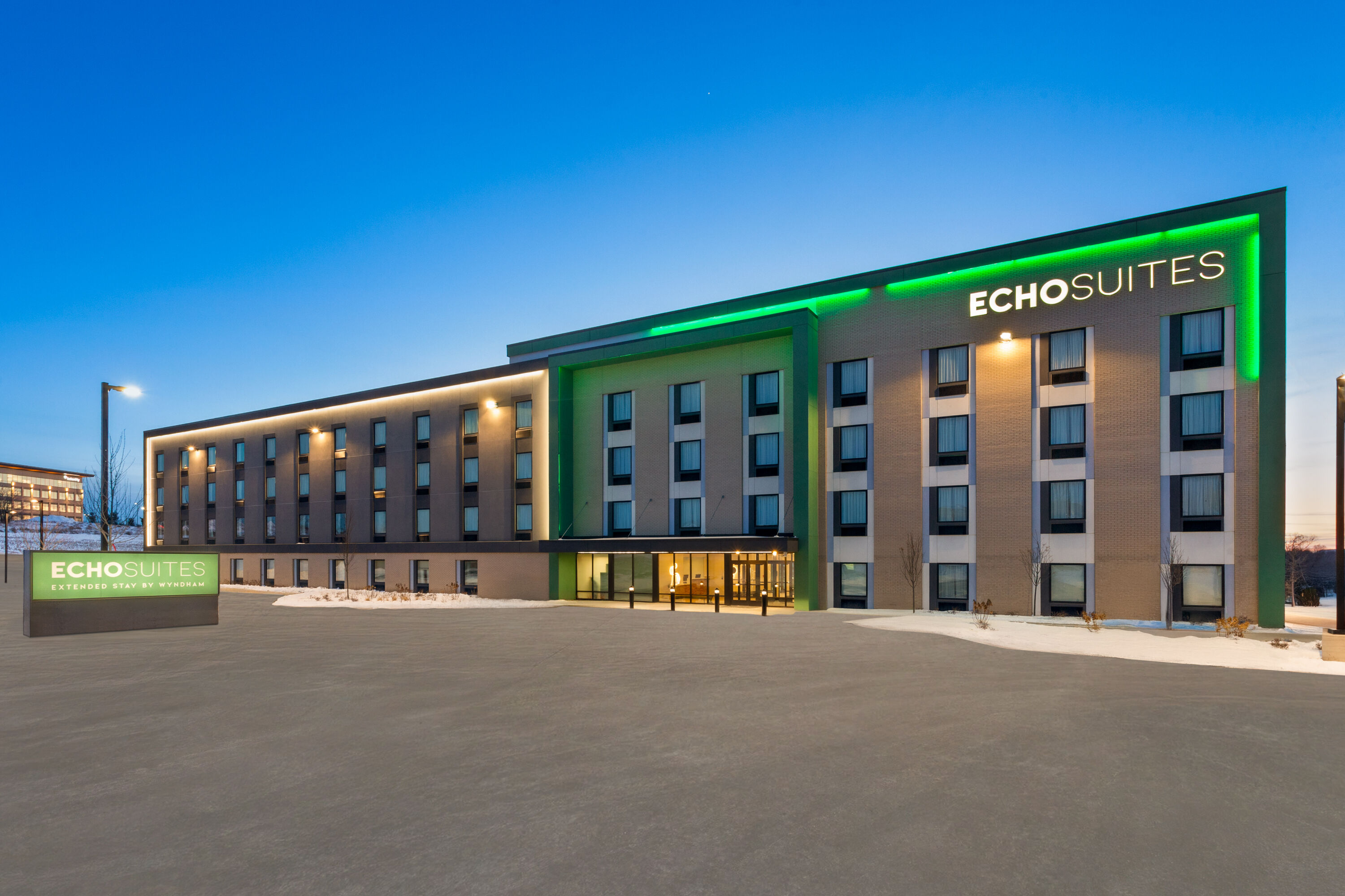 Exterior Dusk Image of ECHO Suites Extended Stay by Wyndham Madison hotel in Madison, Wisconsin
