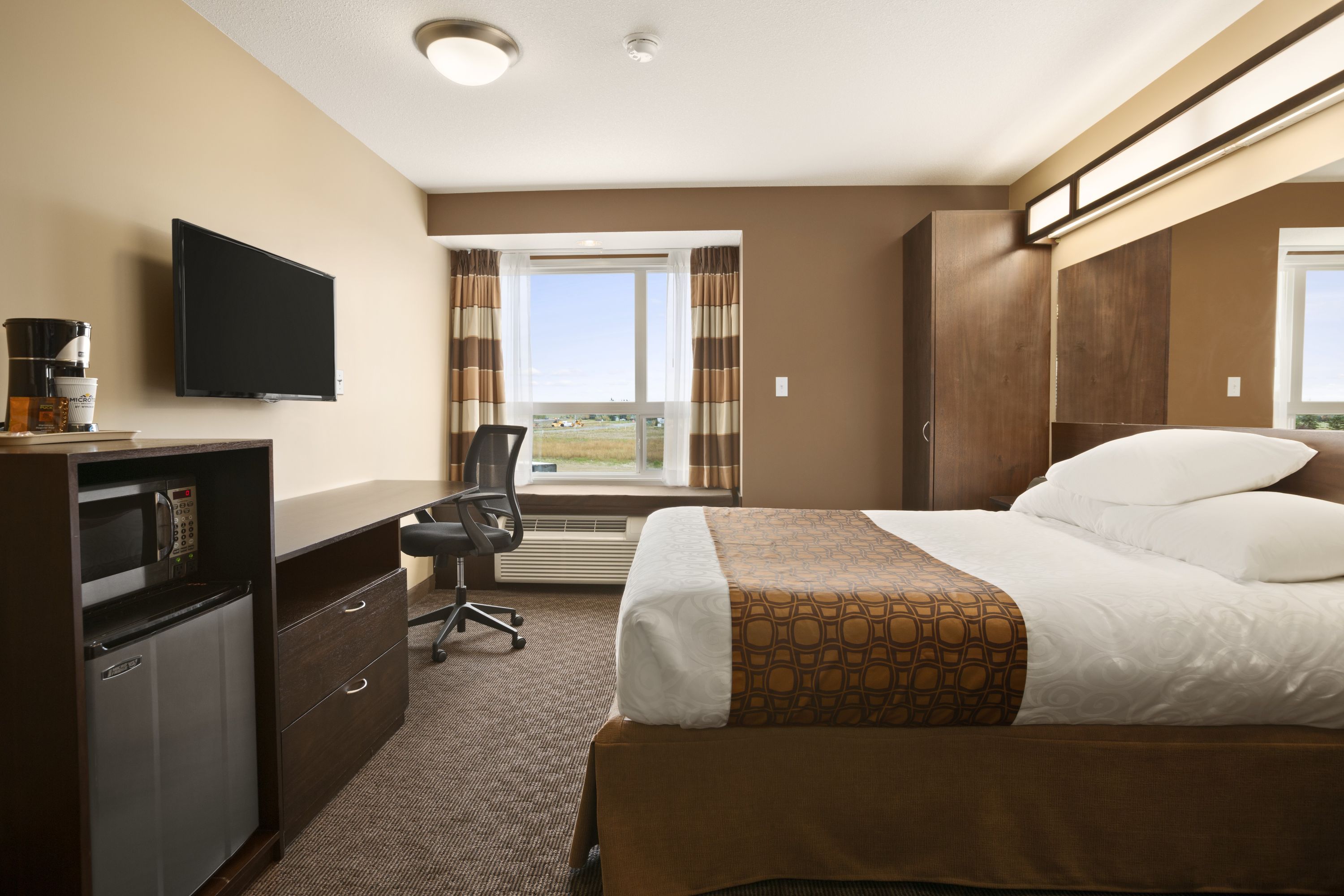 Guest room at the Microtel Inn & Suites by Wyndham Blackfalds Red Deer North in Blackfalds, Alberta
