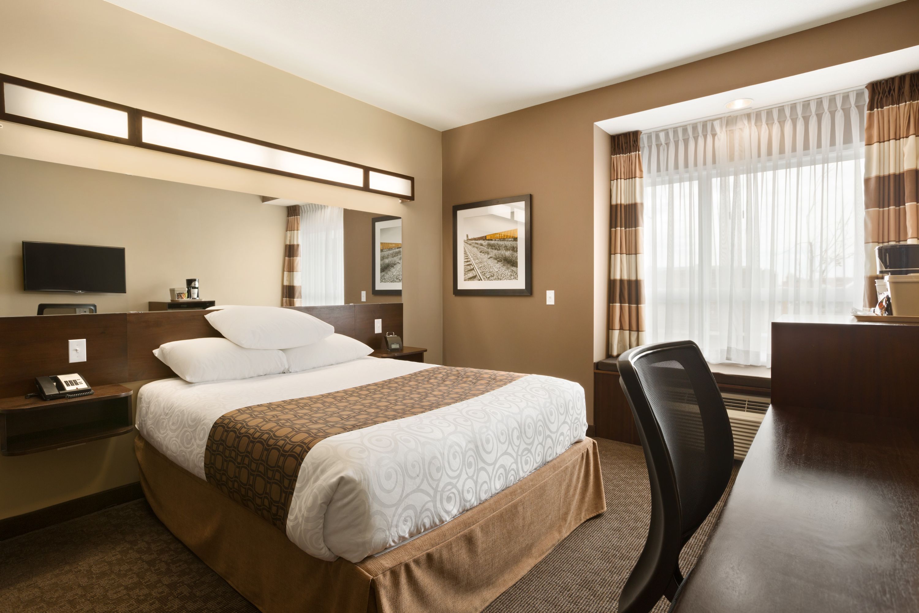 Guest room at the Microtel Inn & Suites by Wyndham Blackfalds Red Deer North in Blackfalds, Alberta