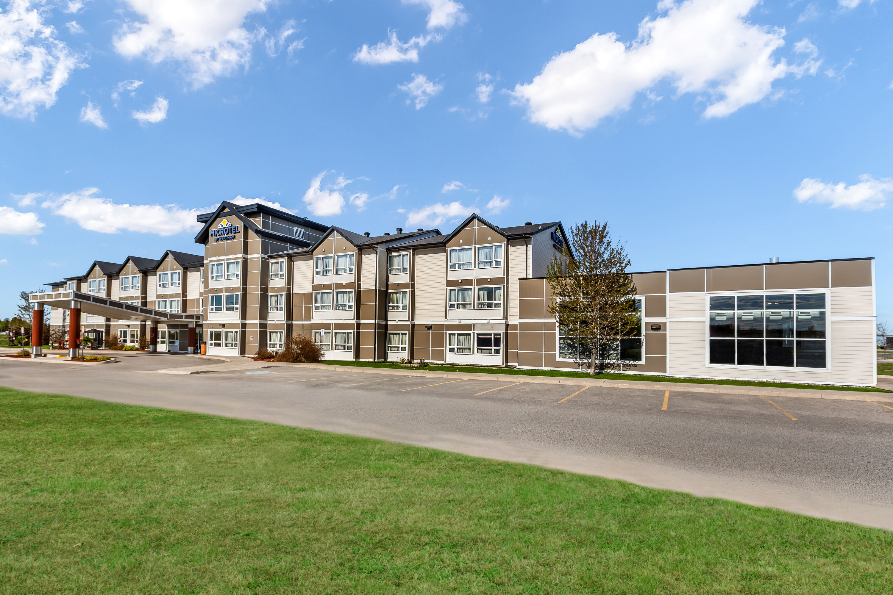 Exterior Day Image of Microtel Inn & Suites by Wyndham Timmins hotel in Timmins, Ontario