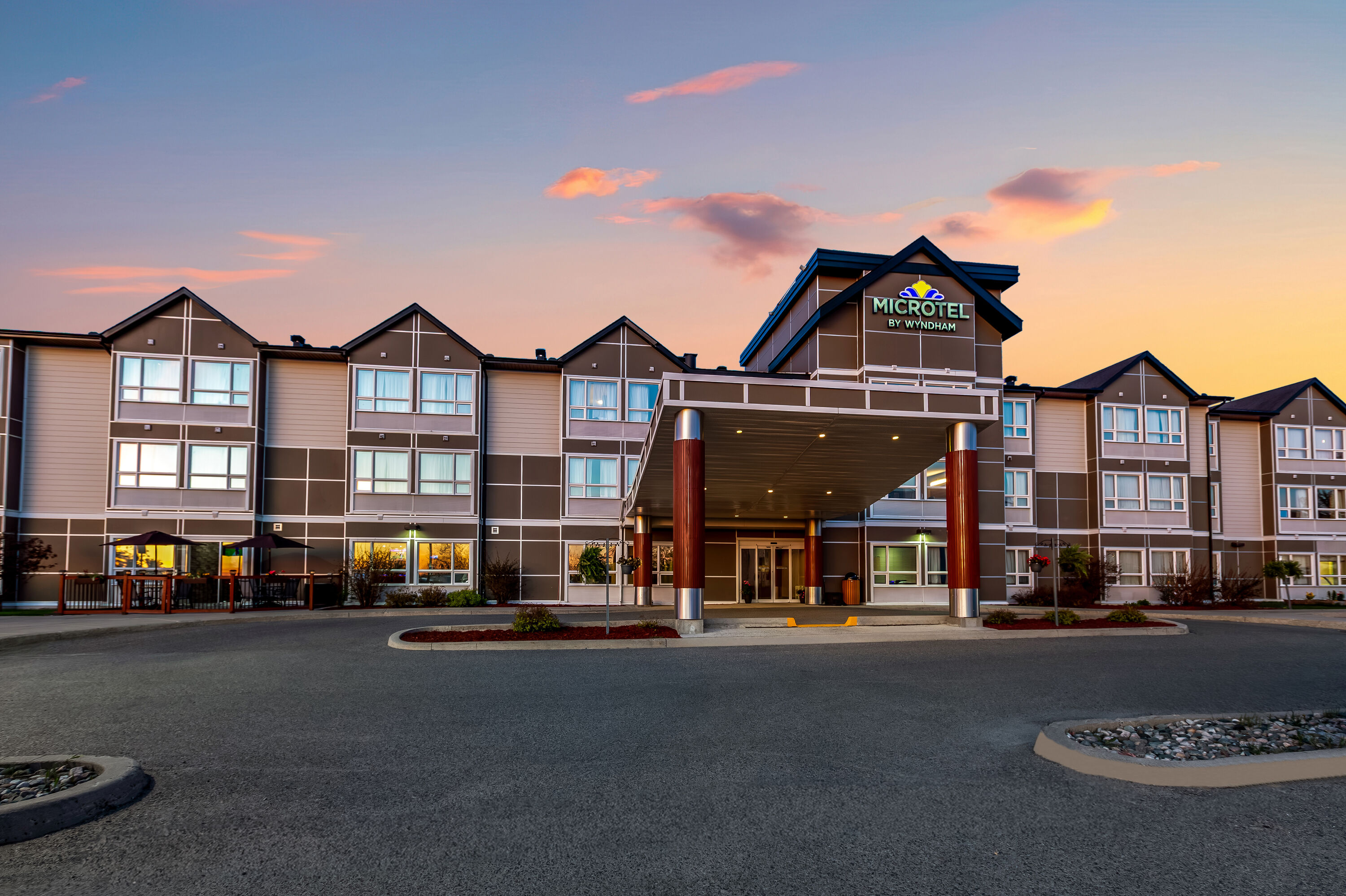 Exterior Dusk Image of Microtel Inn & Suites by Wyndham Timmins hotel in Timmins, Ontario