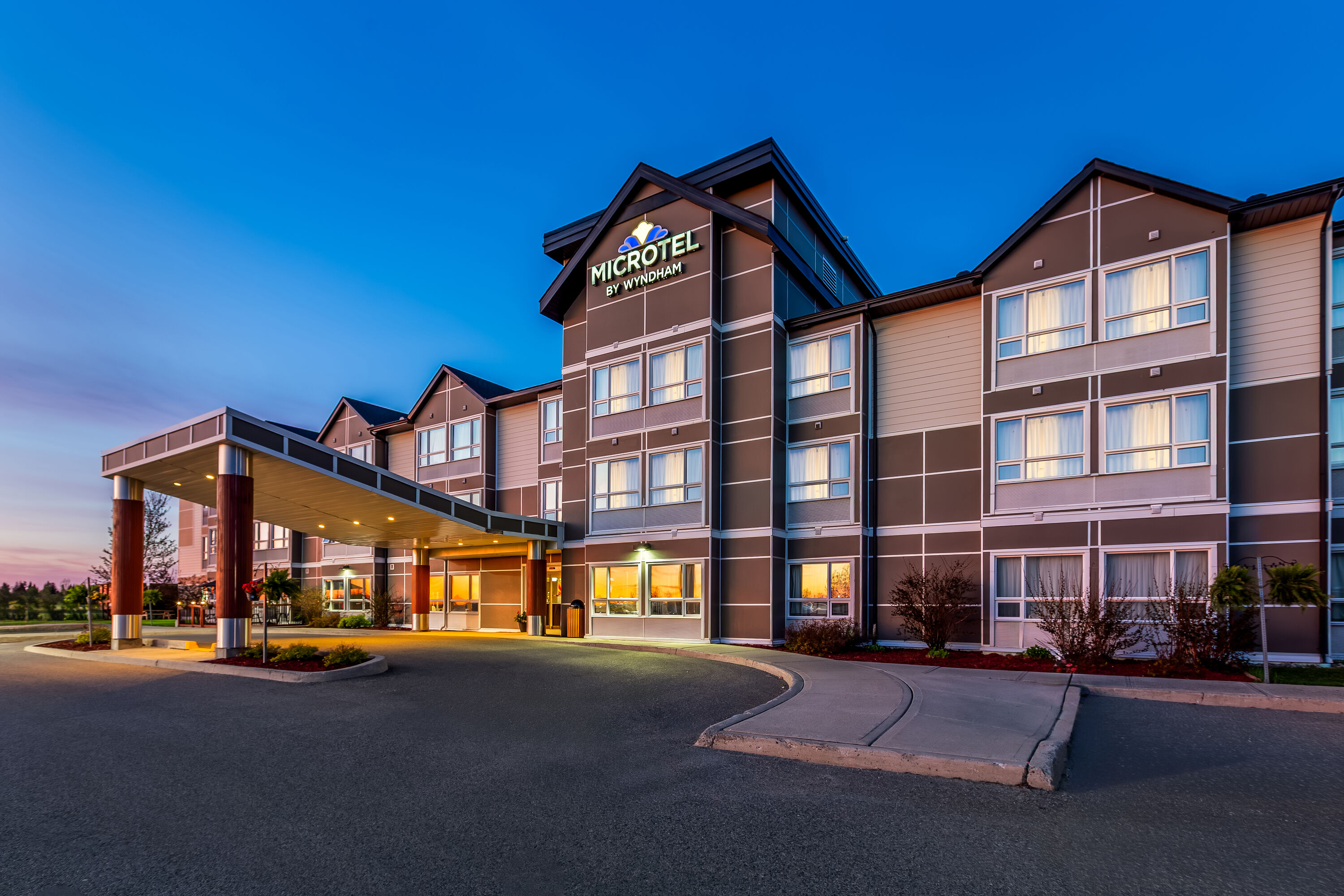 Exterior Dusk Image of Microtel Inn & Suites by Wyndham Timmins hotel in Timmins, Ontario