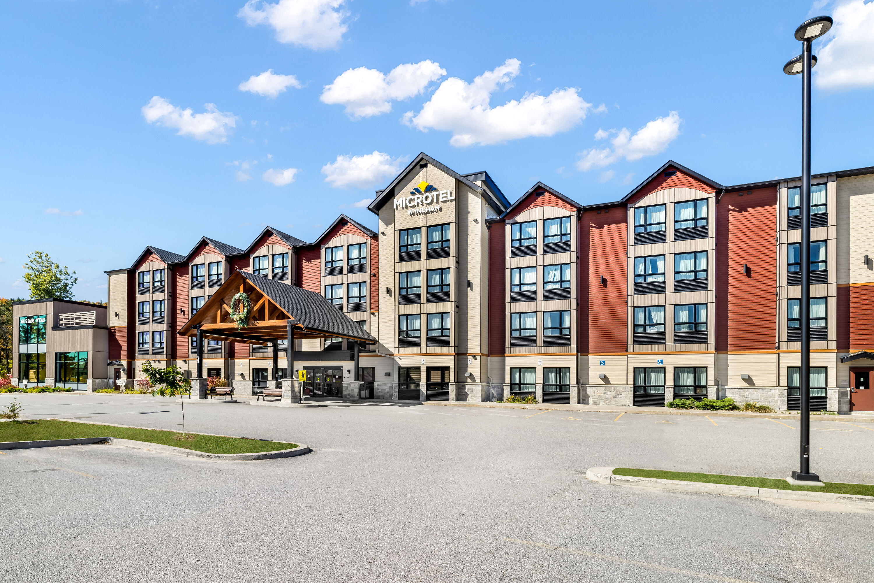 Exterior Day Image of Microtel Inn & Suites by Wyndham Mont Tremblant hotel in Mont-Tremblant, Quebec