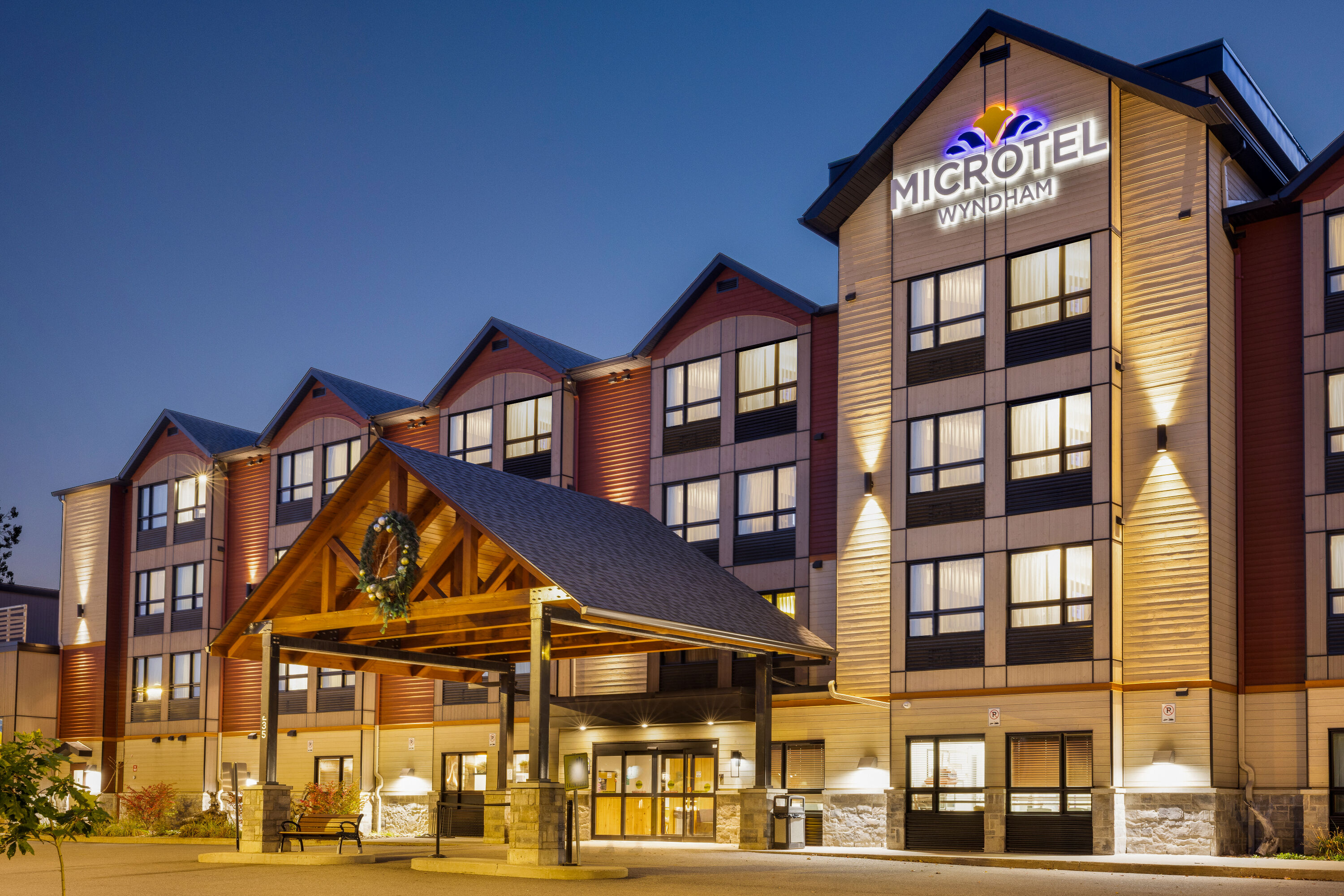 Exterior Dusk Image of Microtel Inn & Suites by Wyndham Mont Tremblant hotel in Mont-Tremblant, Quebec