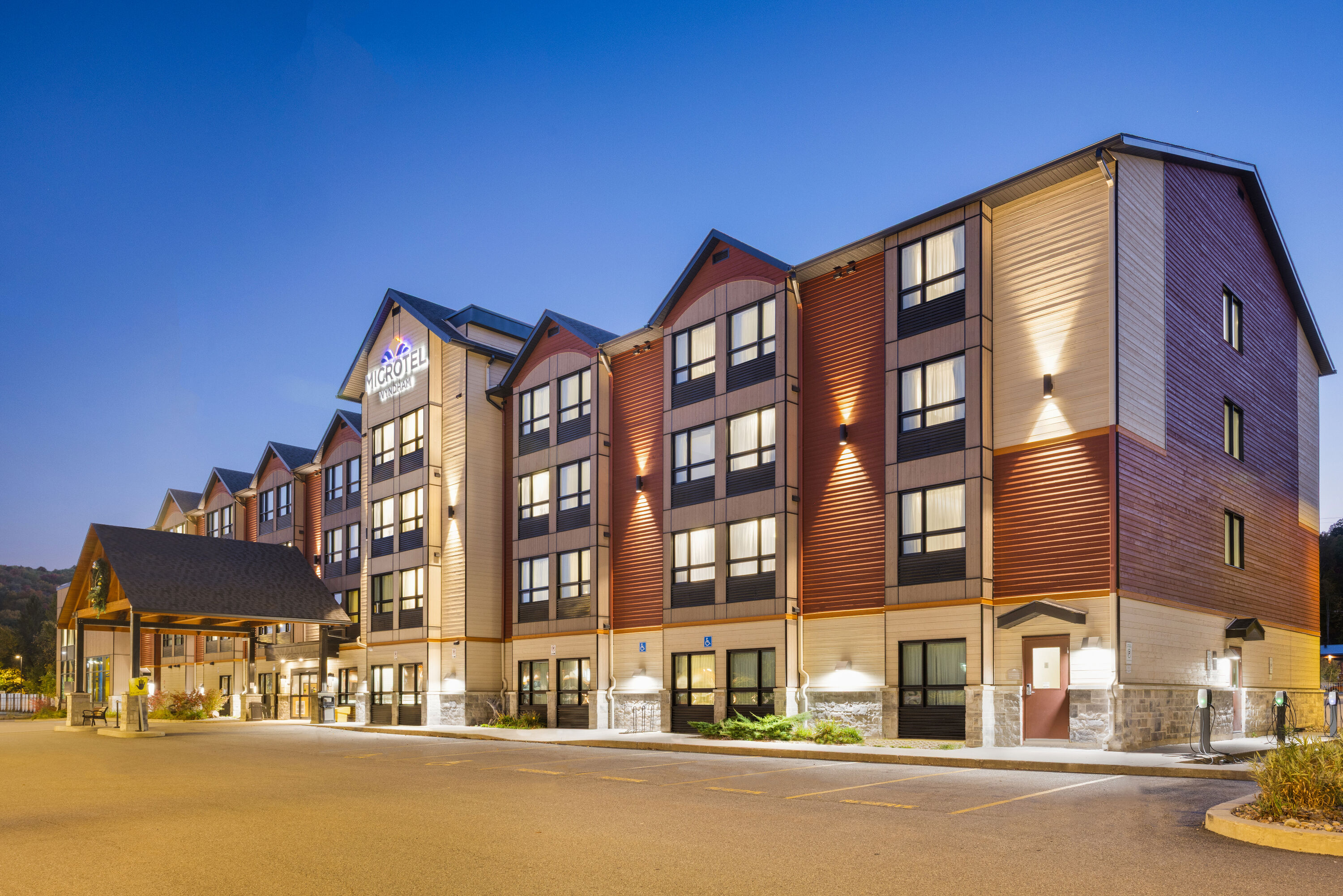 Exterior Dusk Image of Microtel Inn & Suites by Wyndham Mont Tremblant hotel in Mont-Tremblant, Quebec