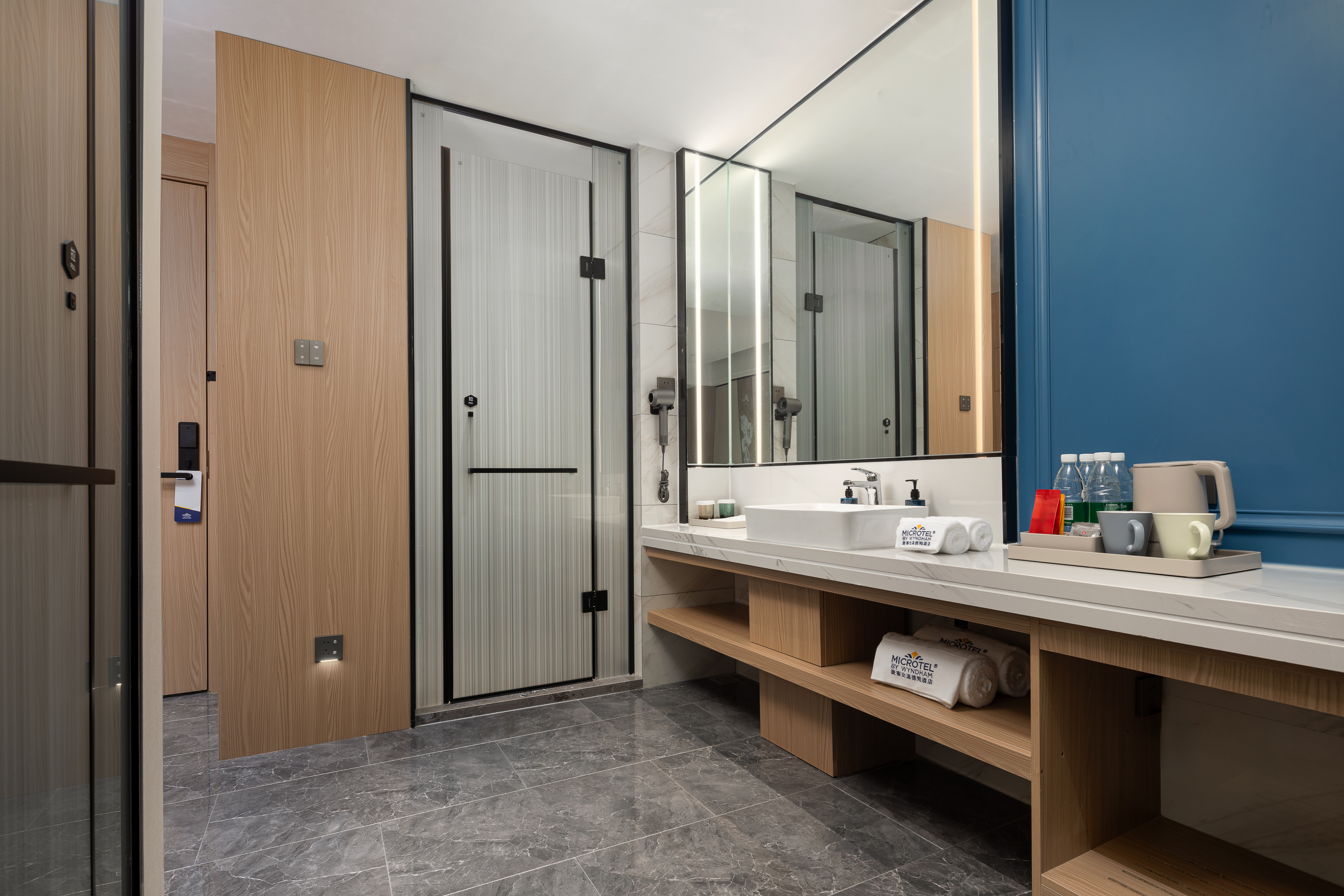 Guest room bath at the Microtel by Wyndham Qingdao Huangdao in Qingdao, Other than US/Canada