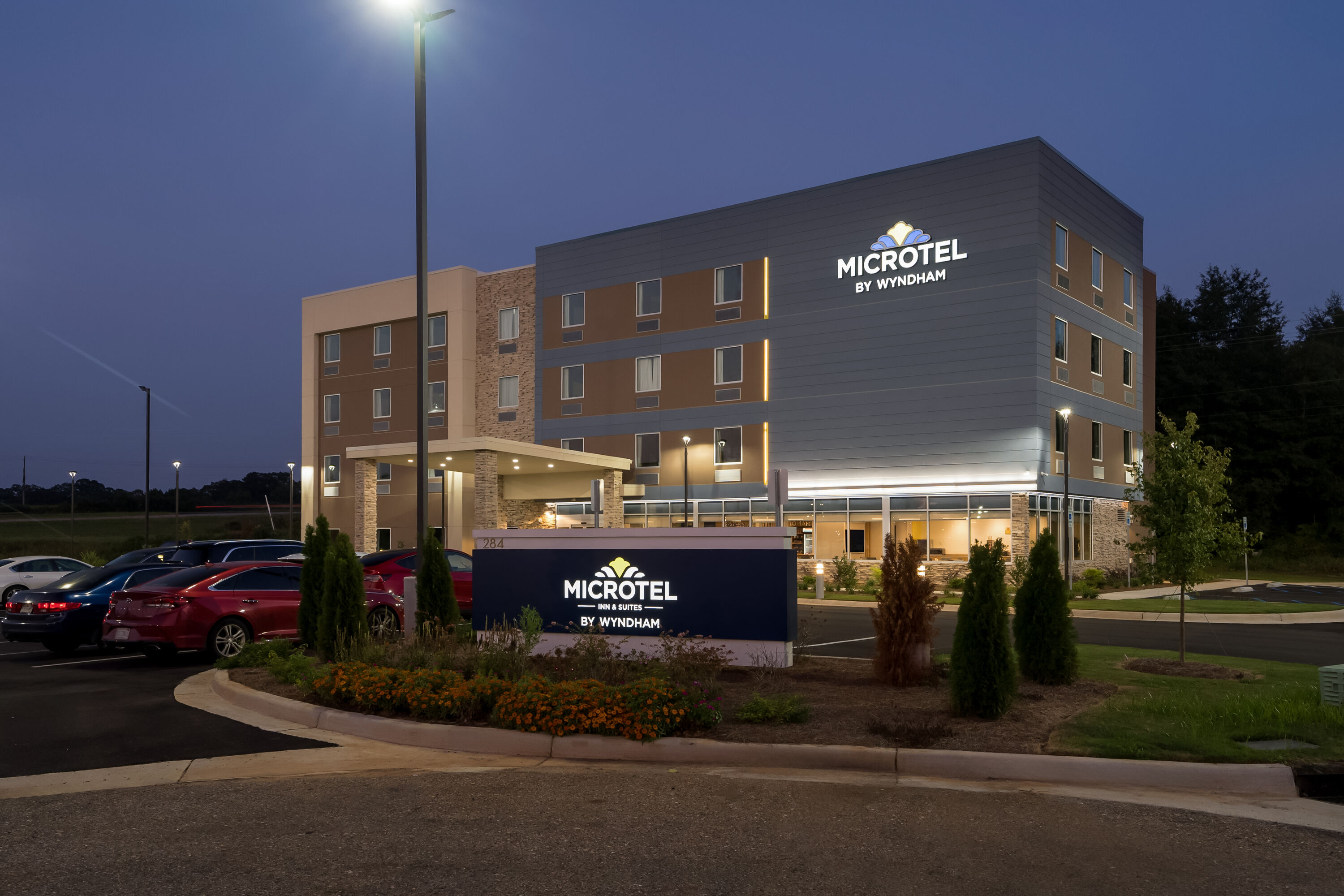 Exterior Night Image of Microtel Inn & Suites by Wyndham Prattville Montgomery hotel in Prattville, Alabama