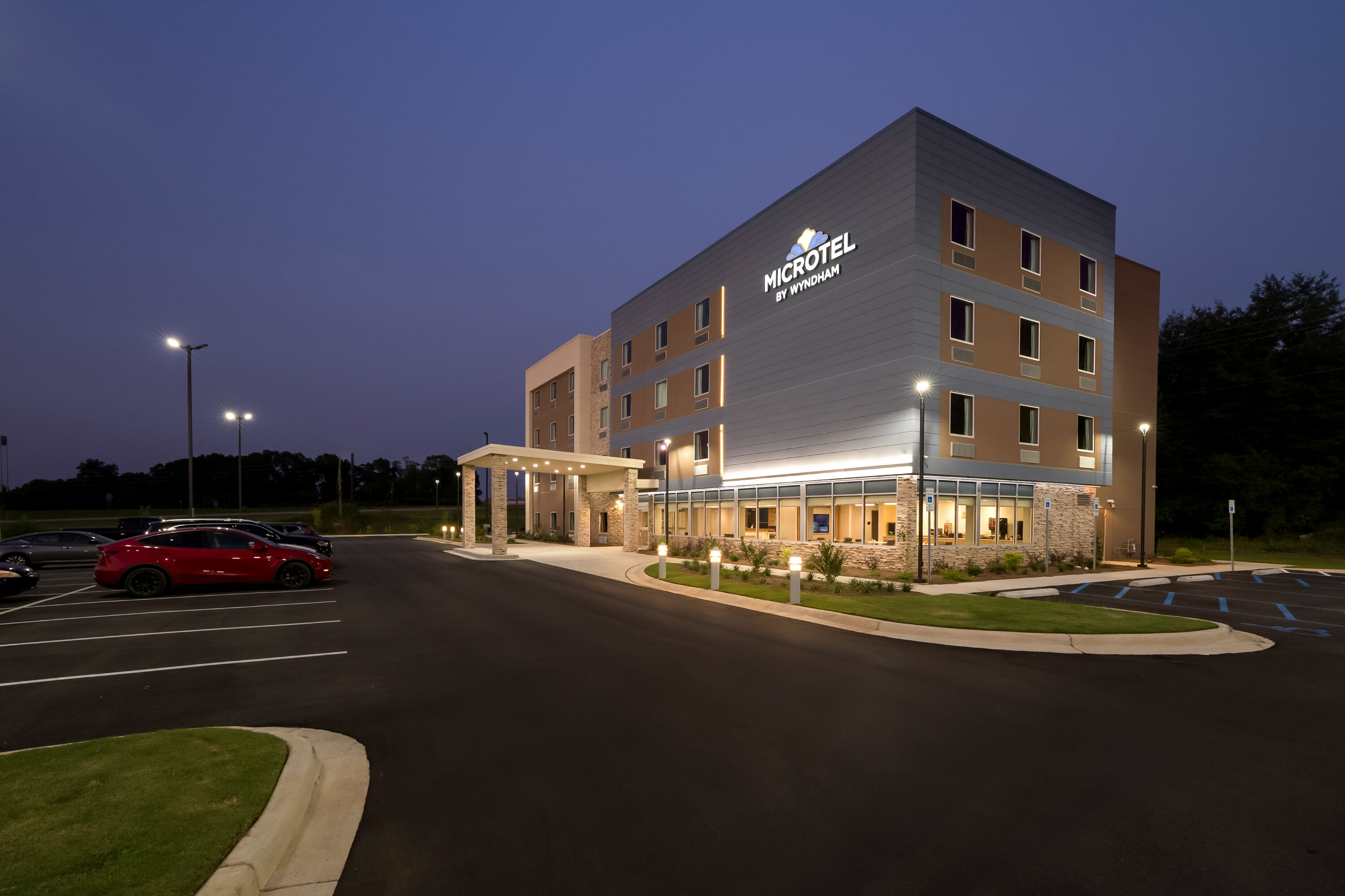 Exterior Night Image of Microtel Inn & Suites by Wyndham Prattville Montgomery hotel in Prattville, Alabama