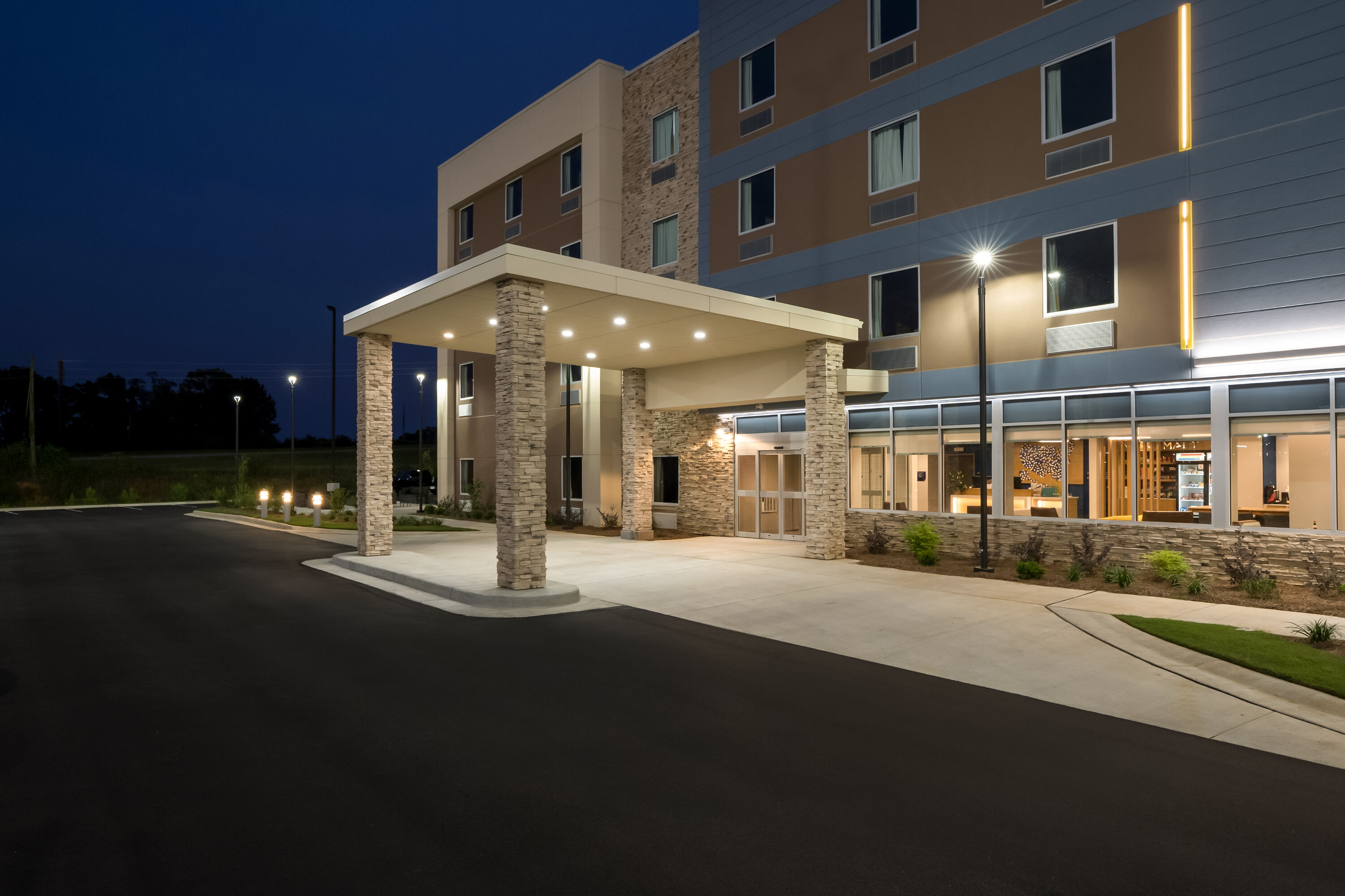 Exterior Night Image of Microtel Inn & Suites by Wyndham Prattville Montgomery hotel in Prattville, Alabama