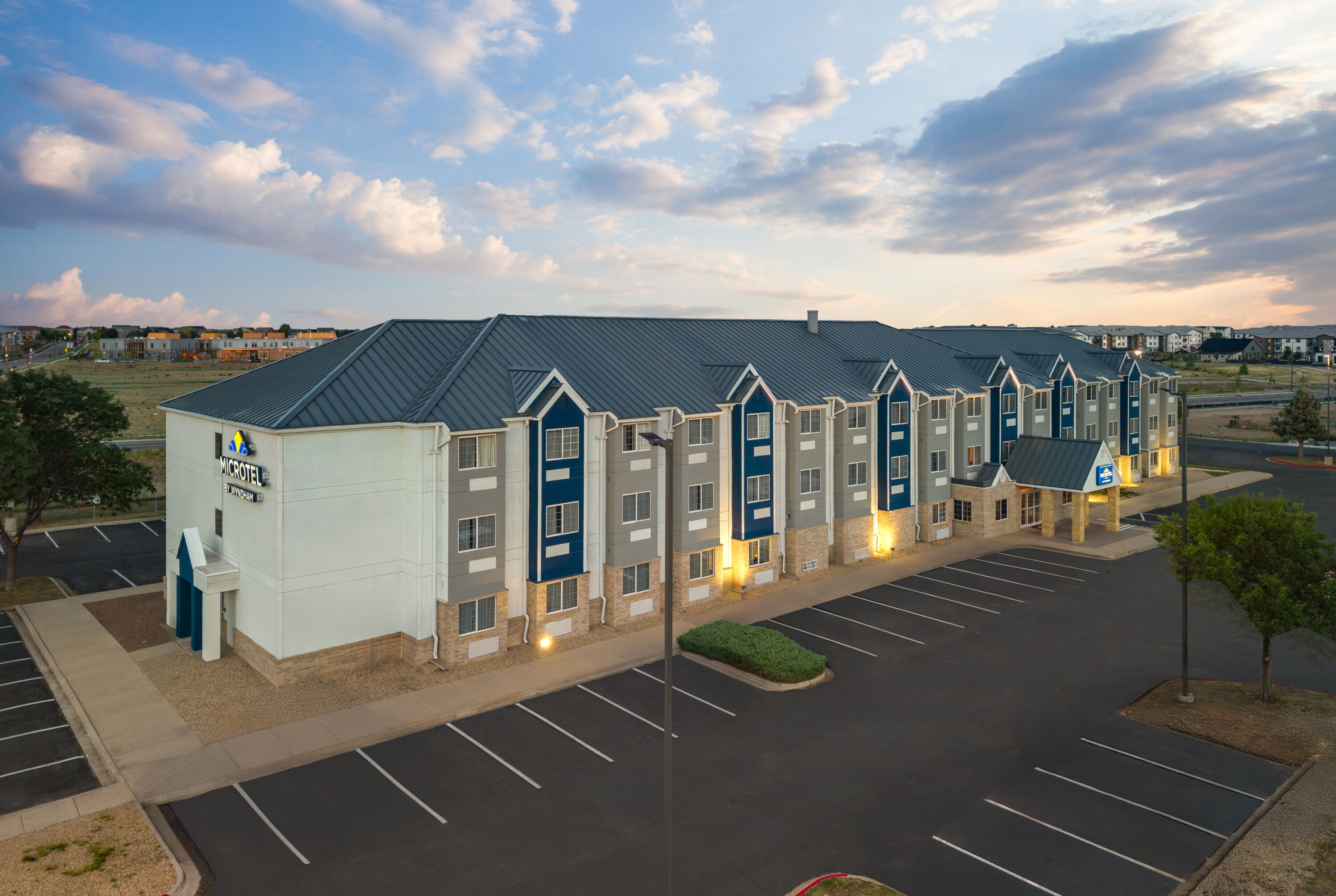 Exterior Dusk Image of Microtel Inn & Suites by Wyndham Denver Airport hotel in Denver, Colorado