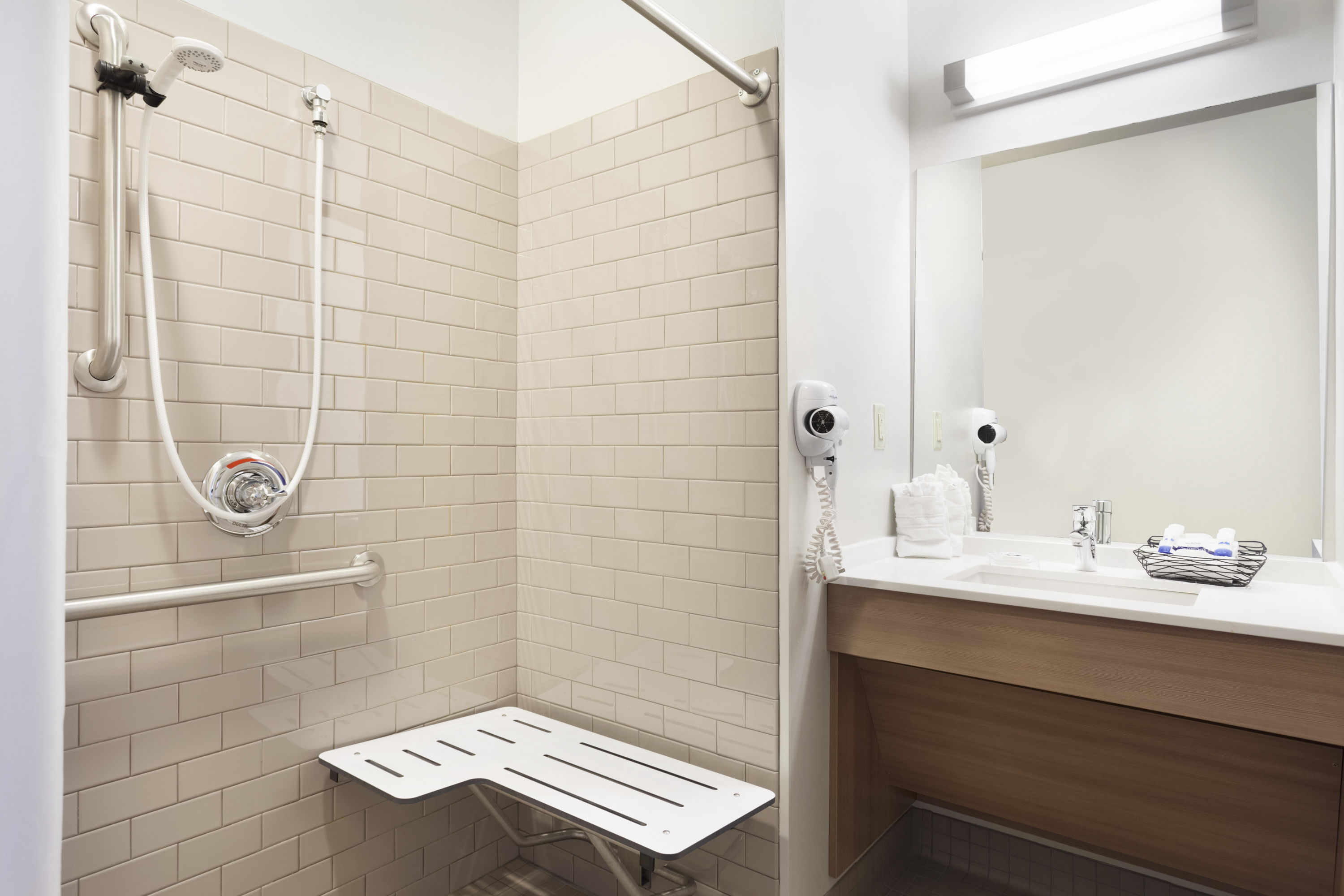 Guest room bath at the Microtel Inn & Suites by Wyndham Georgetown Delaware Beaches in Georgetown, Delaware