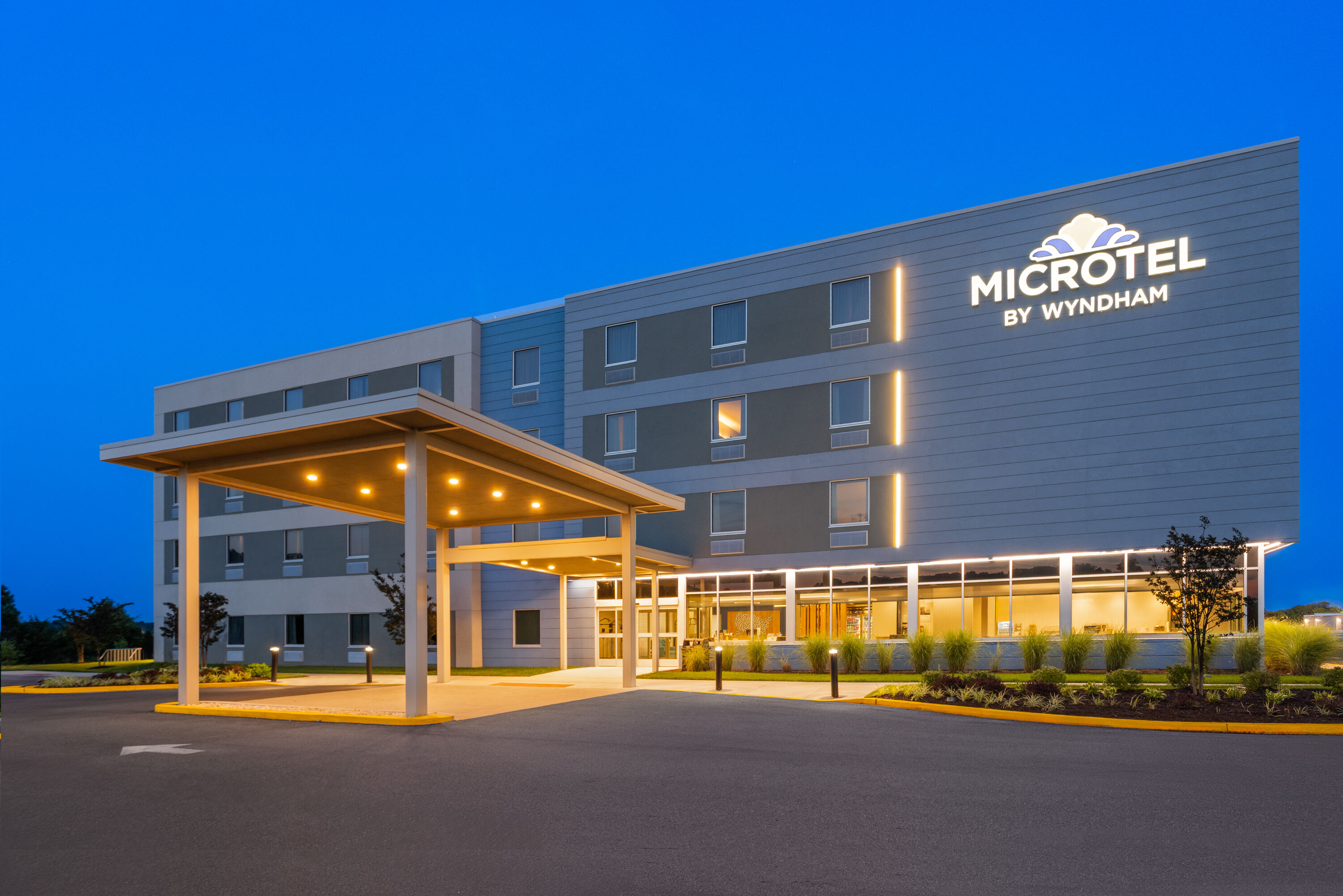 Exterior Dusk Image of Microtel Inn & Suites by Wyndham Rehoboth Beach hotel in Rehoboth Beach, Delaware