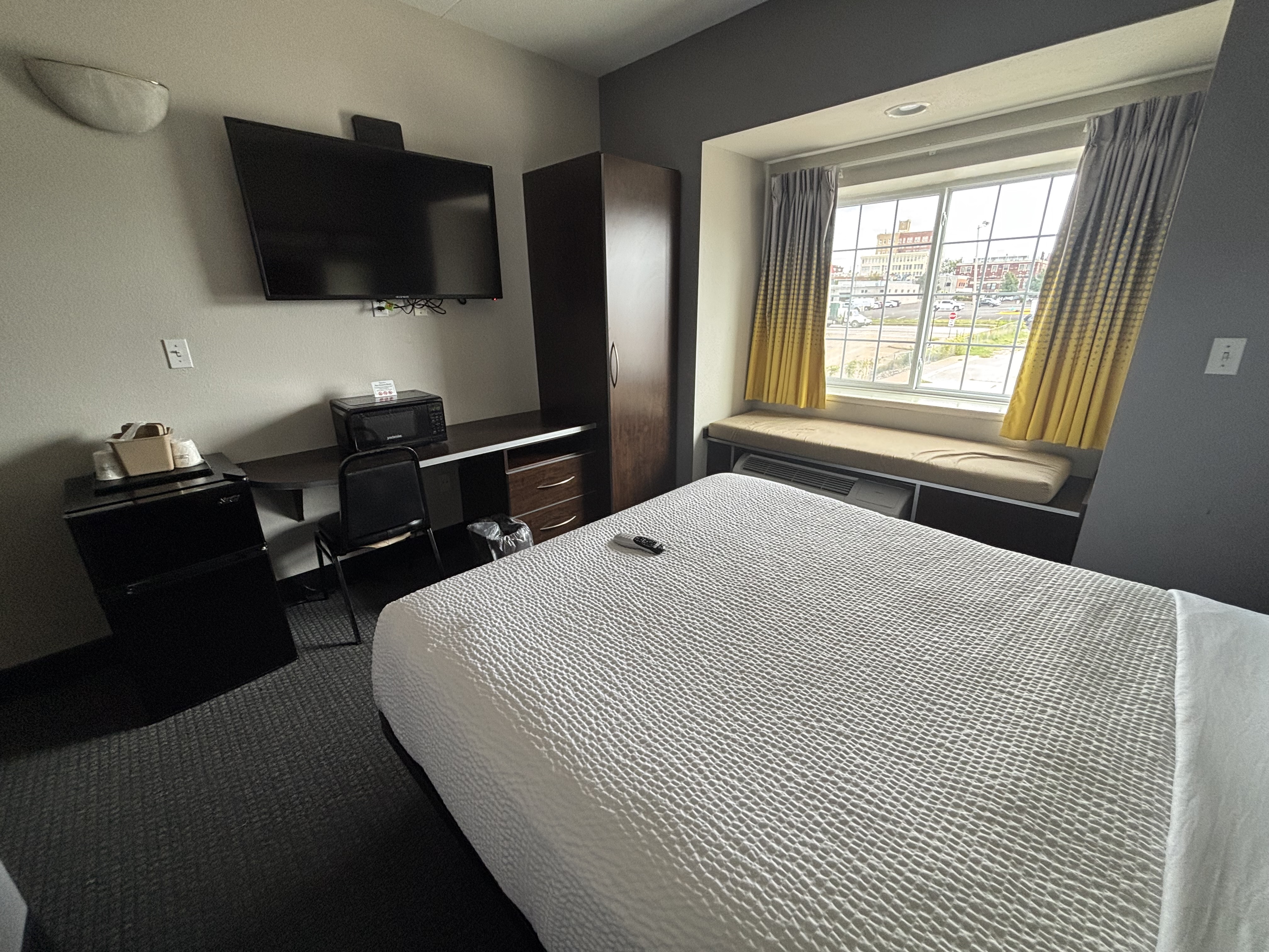 King bed guest room at the Microtel Inn & Suites by Wyndham Quincy Downtown/River Area in Quincy, Illinois