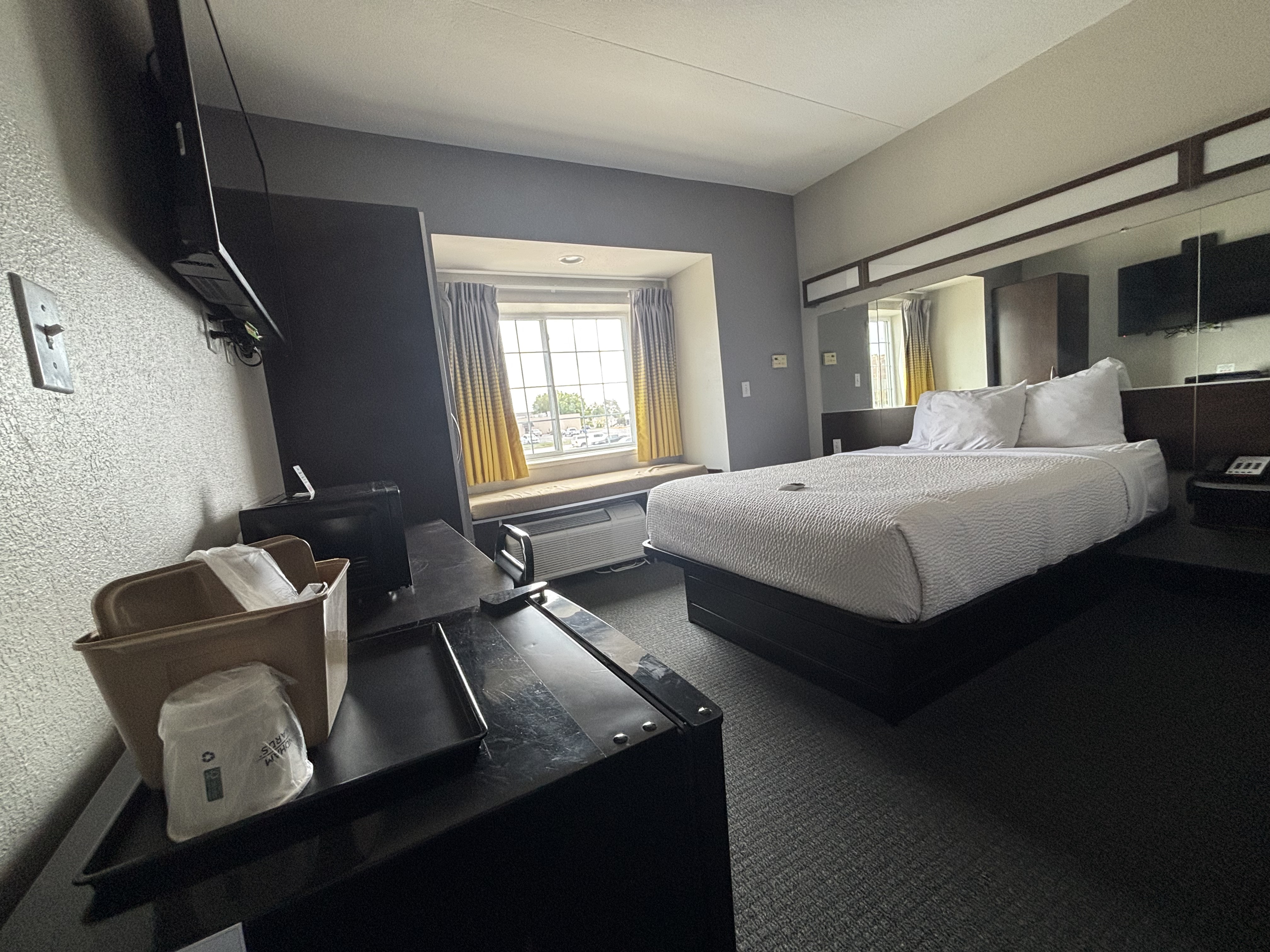 King bed guest room at the Microtel Inn & Suites by Wyndham Quincy Downtown/River Area in Quincy, Illinois