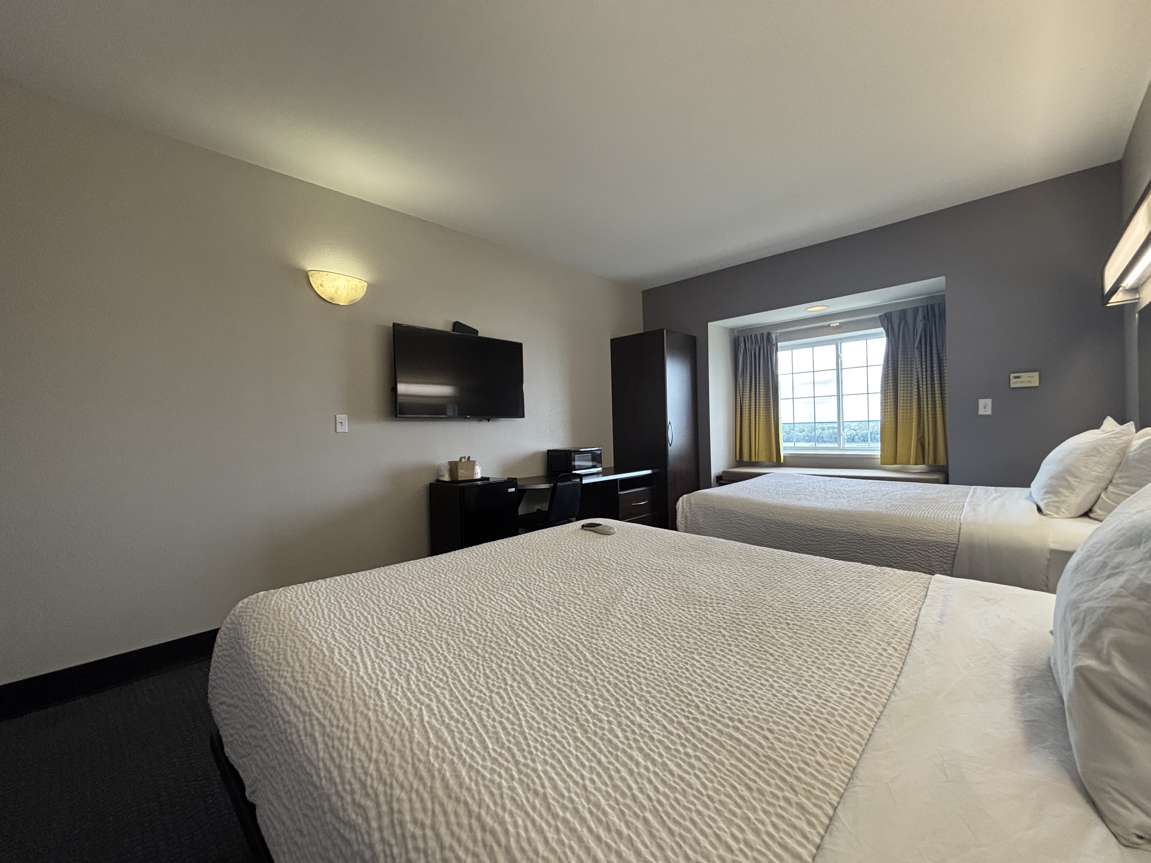 King bed guest room at the Microtel Inn & Suites by Wyndham Quincy Downtown/River Area in Quincy, Illinois