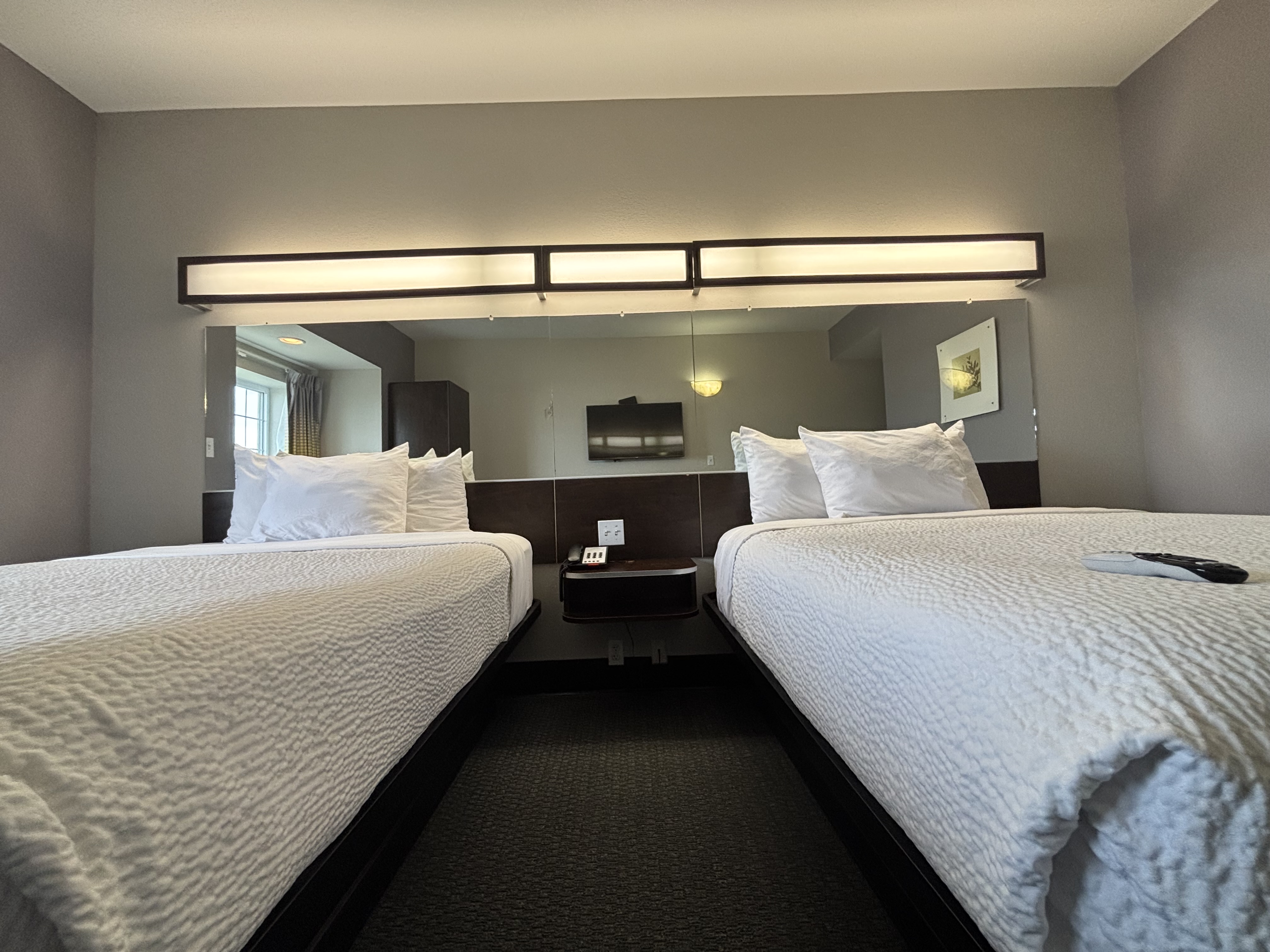 King bed guest room at the Microtel Inn & Suites by Wyndham Quincy Downtown/River Area in Quincy, Illinois