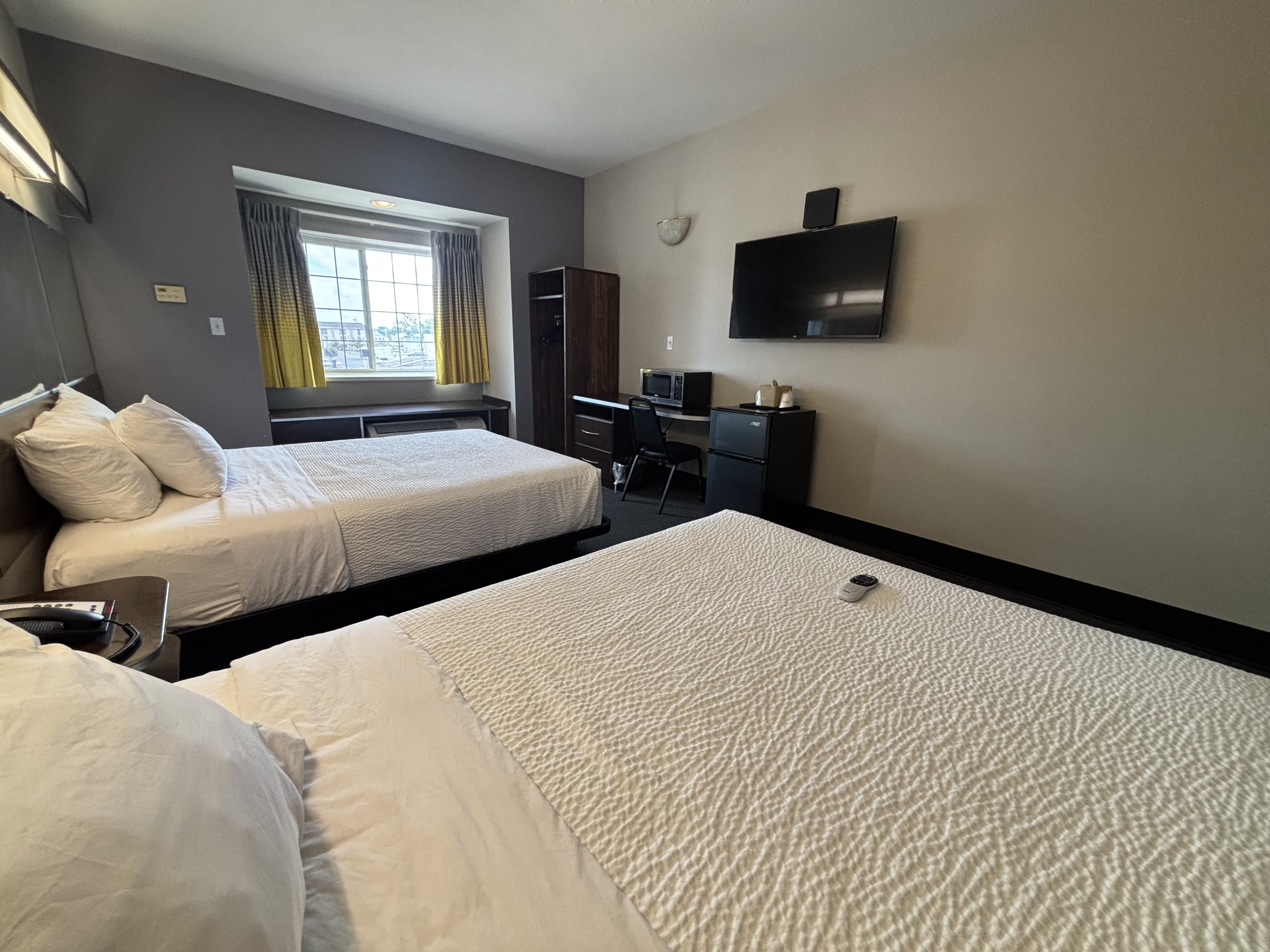 King bed guest room at the Microtel Inn & Suites by Wyndham Quincy Downtown/River Area in Quincy, Illinois