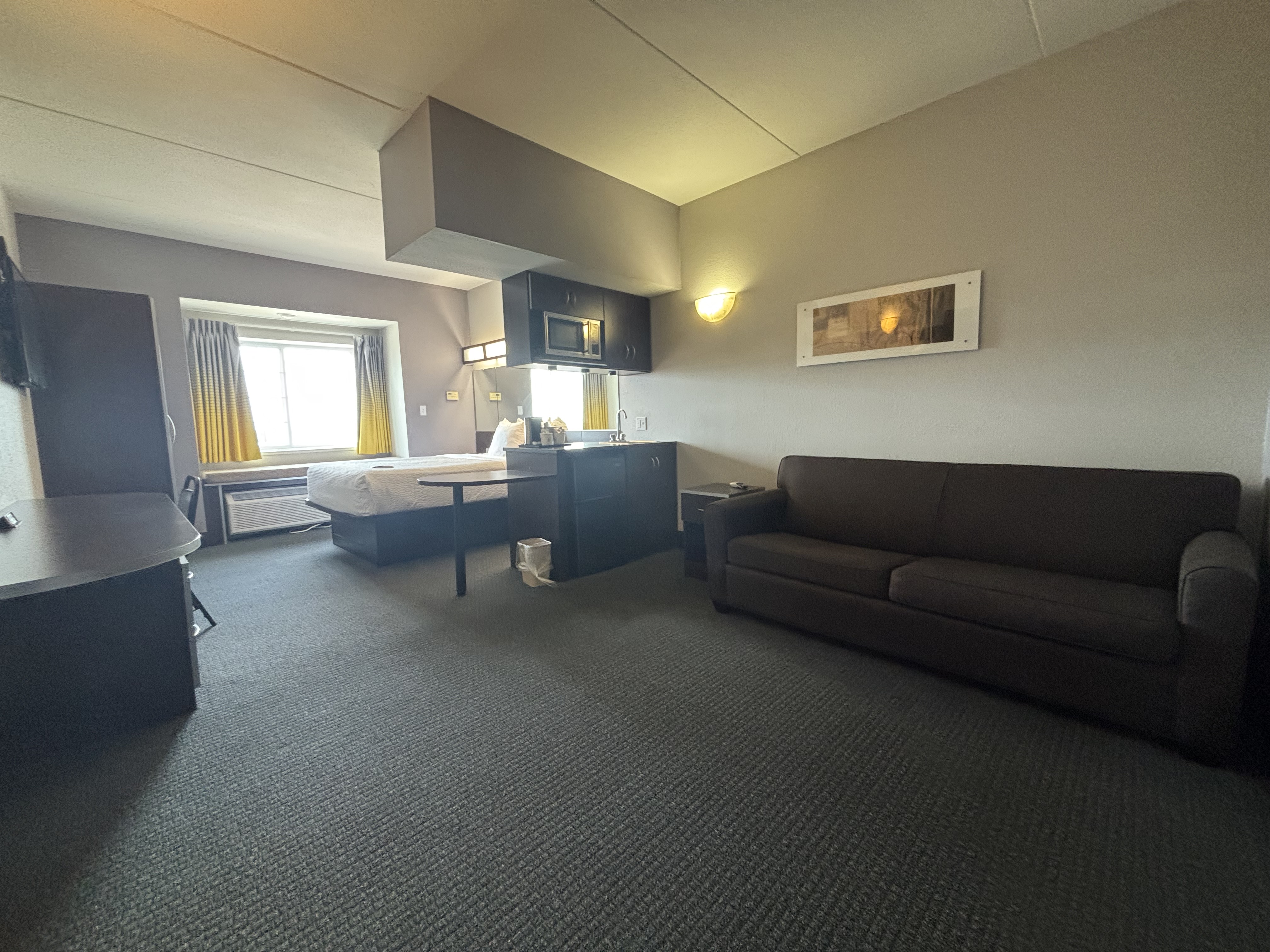 King bed guest room at the Microtel Inn & Suites by Wyndham Quincy Downtown/River Area in Quincy, Illinois